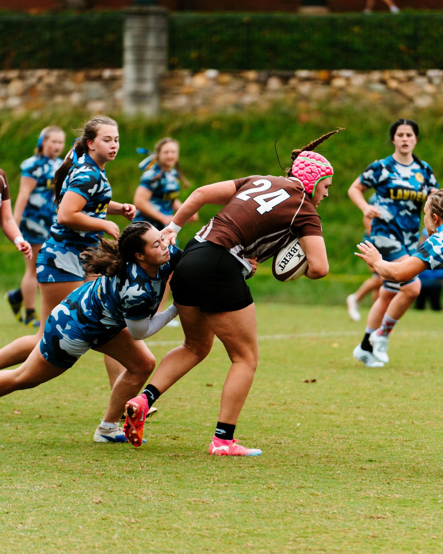 Bonnies Women's Rugby player, Madison Moeller, powers through the defense.