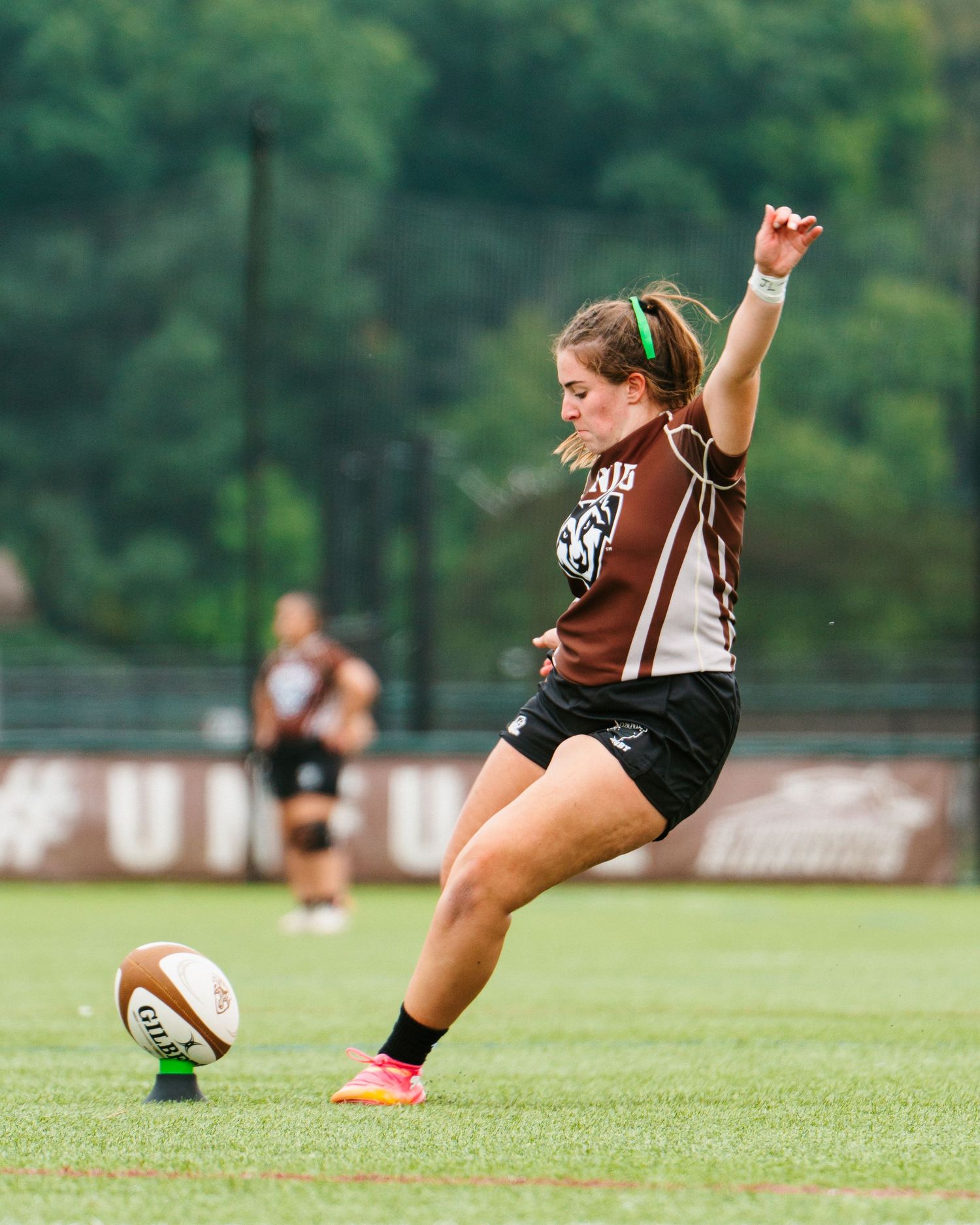 Bonnies Women's Rugby player, Elliot Bitondo, kicks for more points.