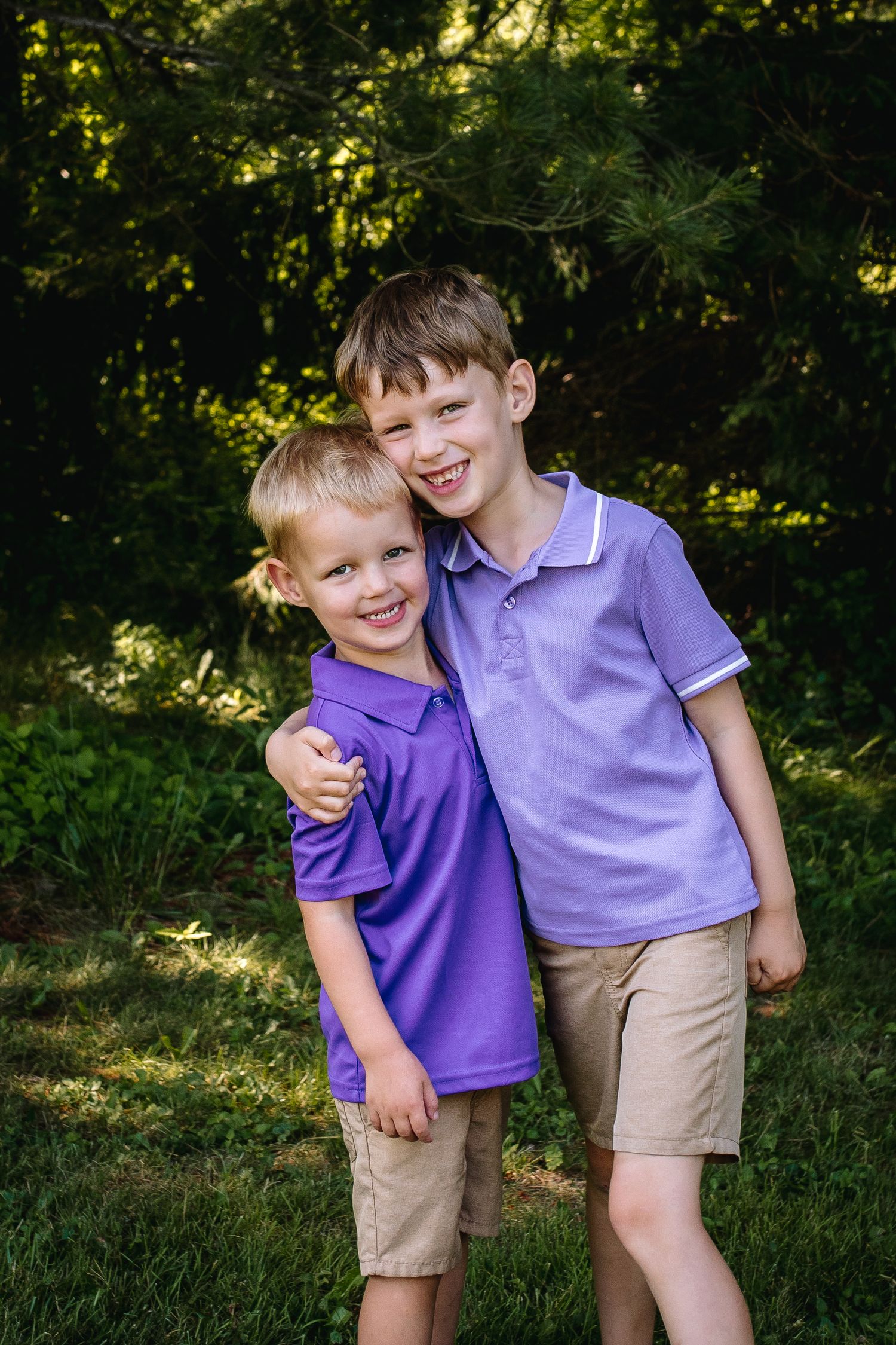 Brothers pose in purple at the park at their family session in Lewiston new york.
