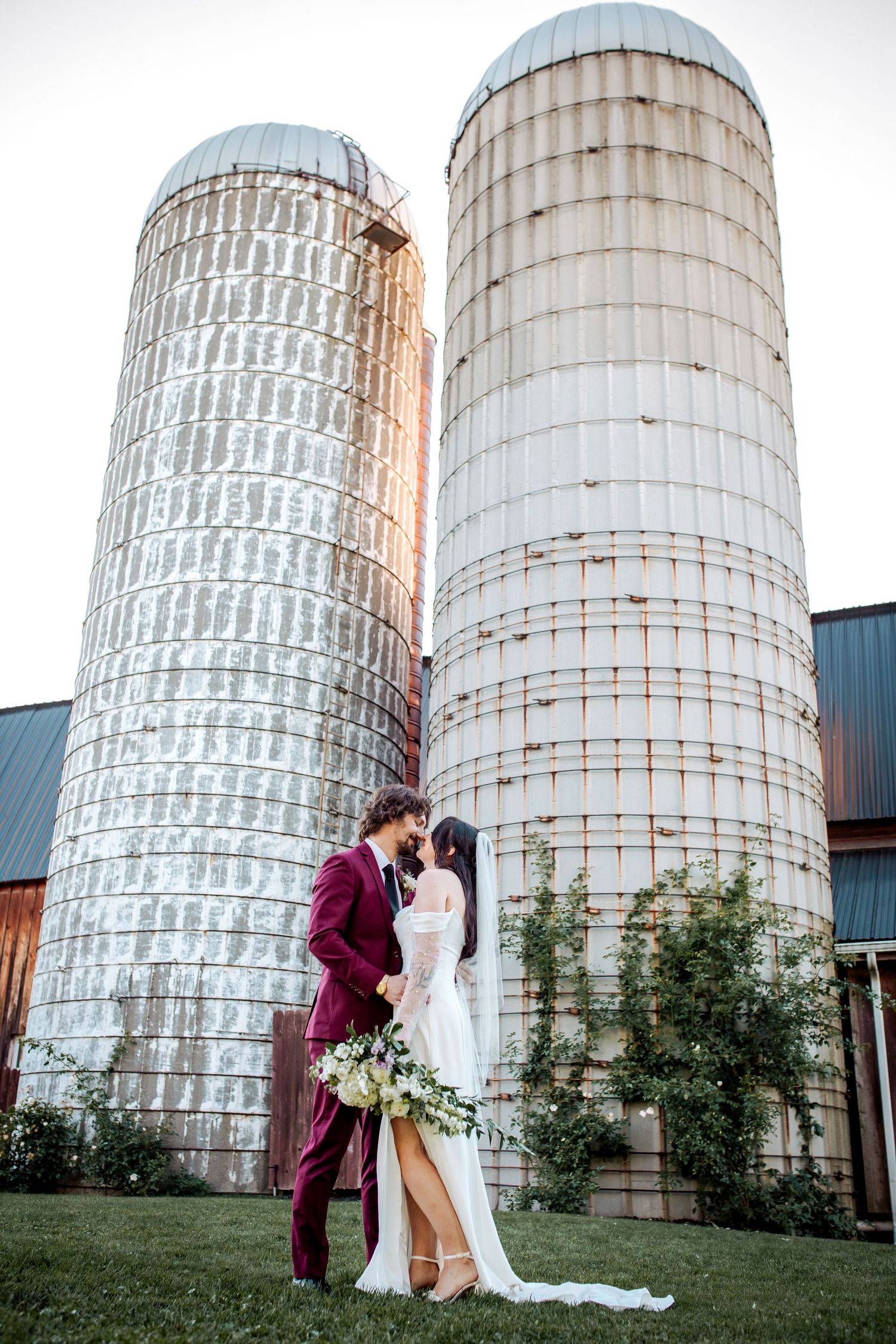 Romantic couple shares intimate moments against rustic farm at twin silos in livonia in a wedding photo collage.