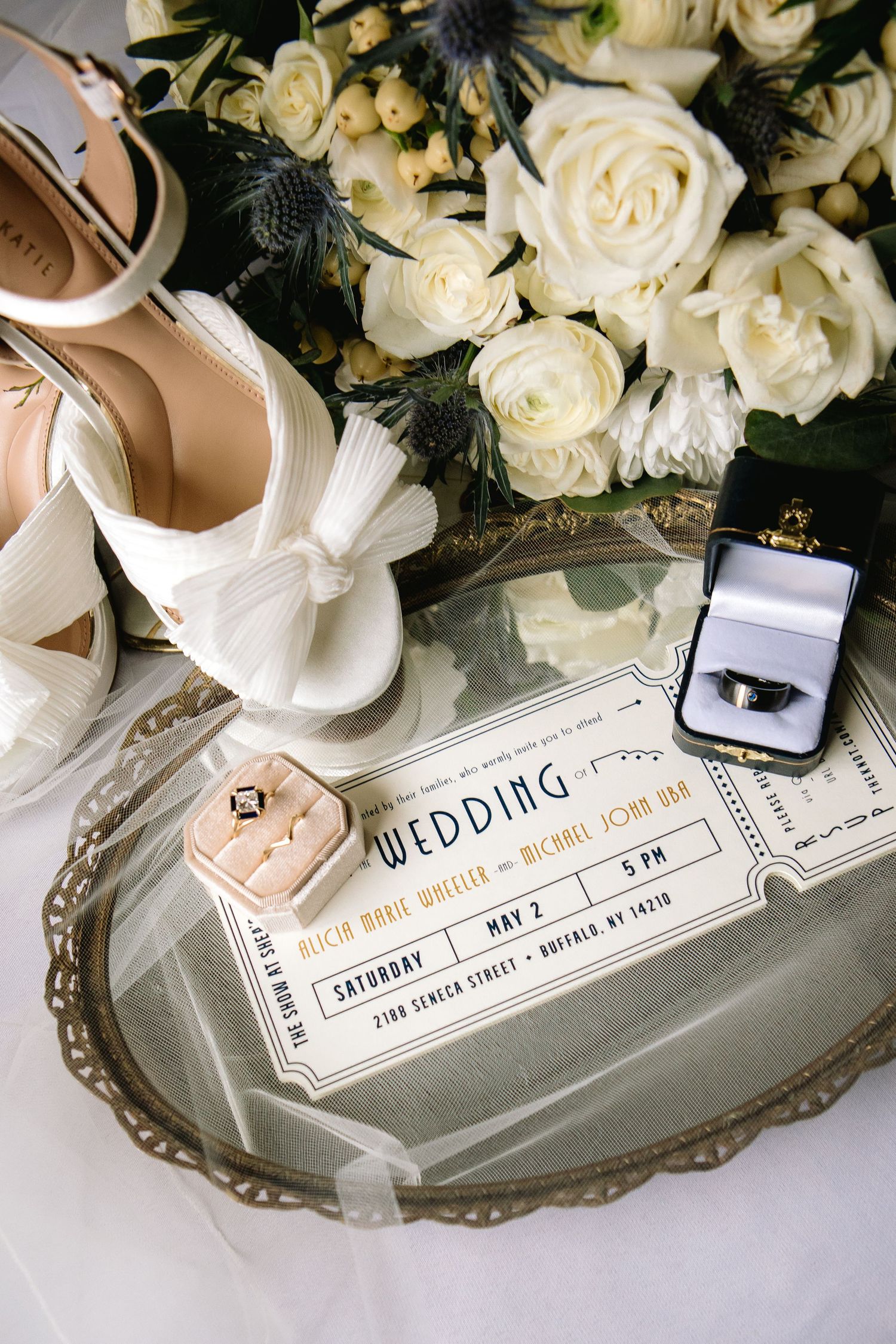 Bridal details including shoes, antique tray, invitation, rings and florals.