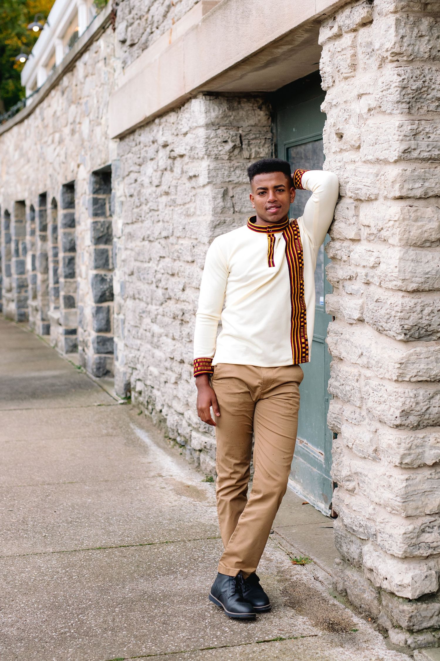 High School Senior Tommy poses by The Terrace during his senior session at hoyt lake in Delaware Park in Buffalo, New York.
