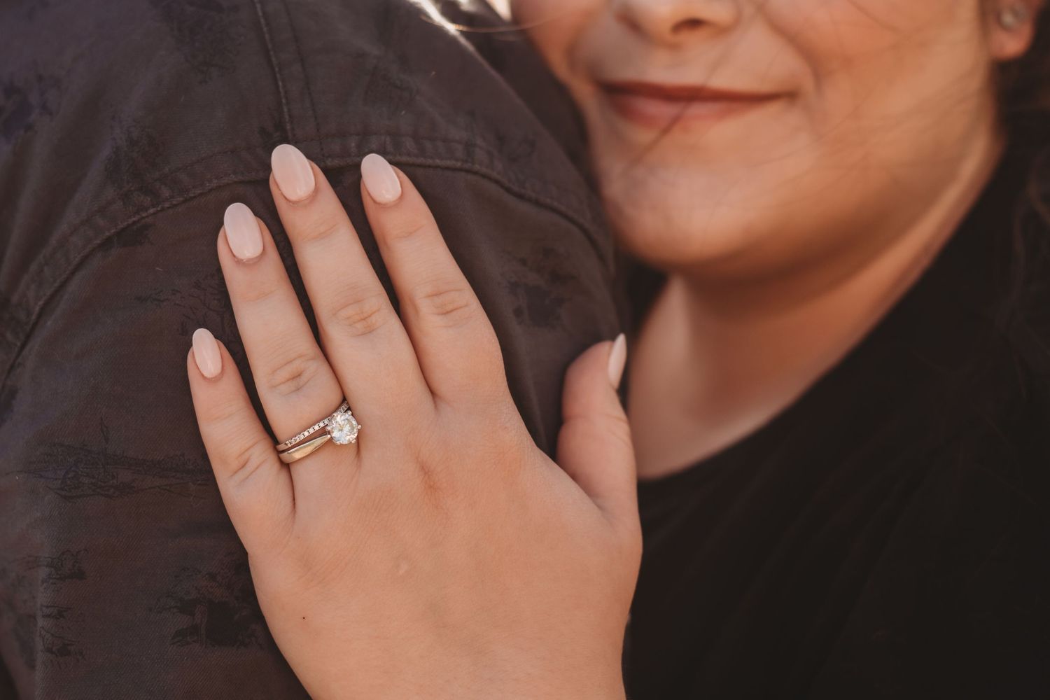 Close-up shots showing hands with engagement rings and joyful expressions.