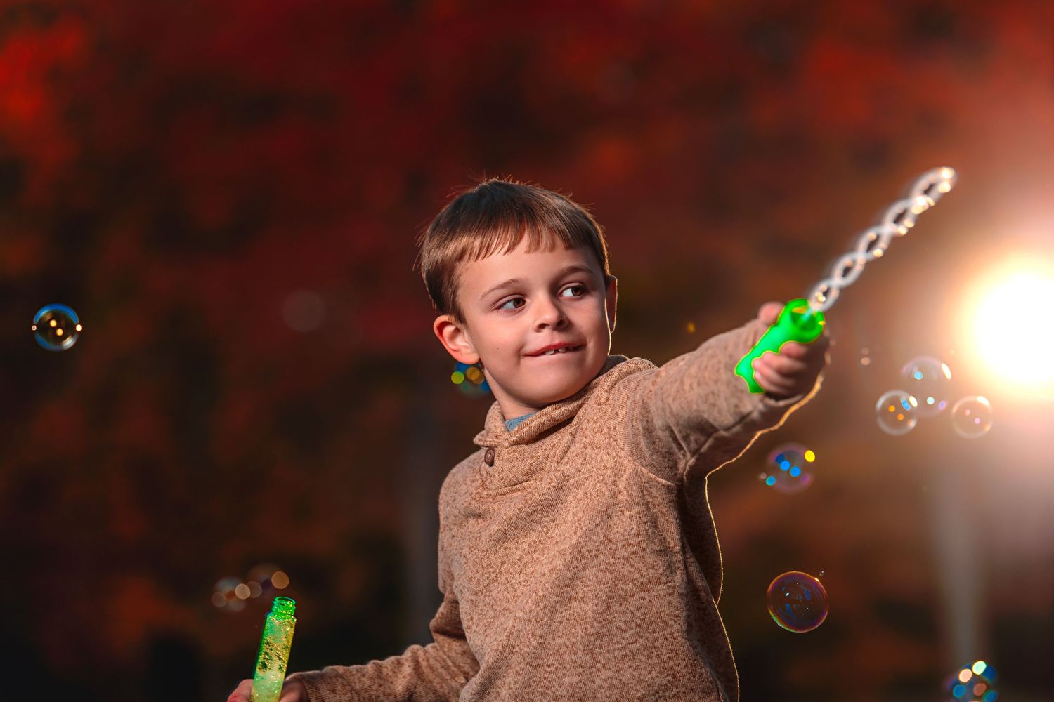 kid playing with bubbles