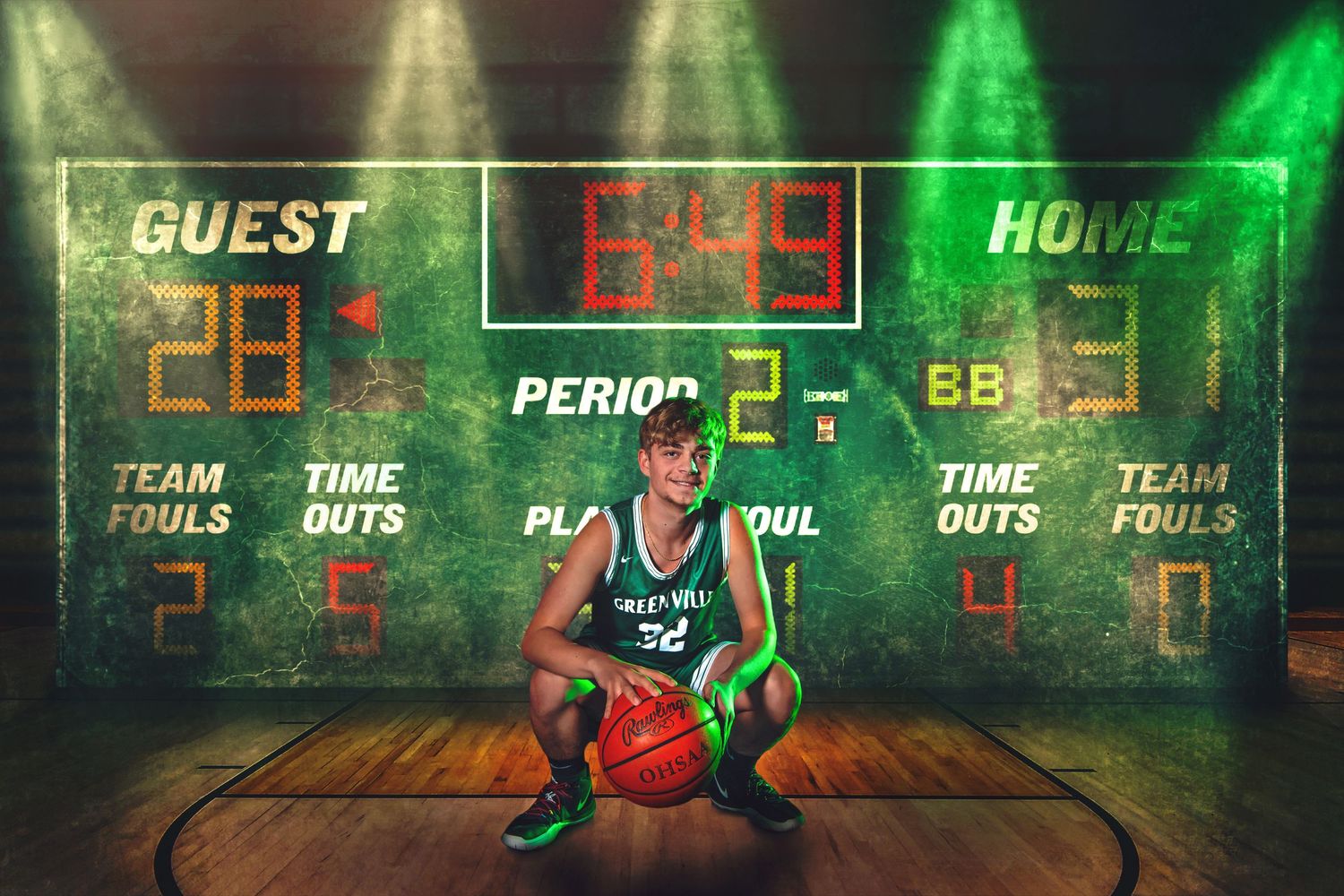A basketball player crouches with a ball in front of a glowing green scoreboard on a hardwood court.