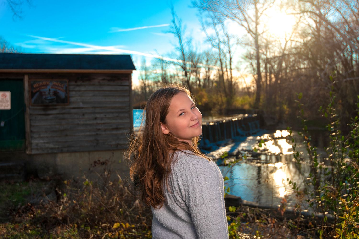 young girl by water
