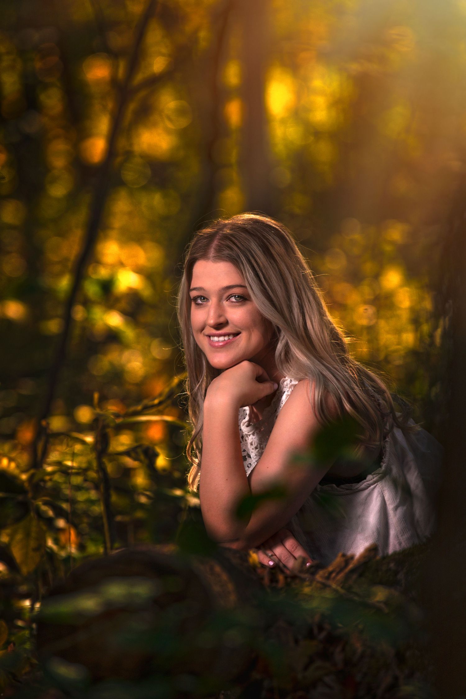 senior girl outside in woods