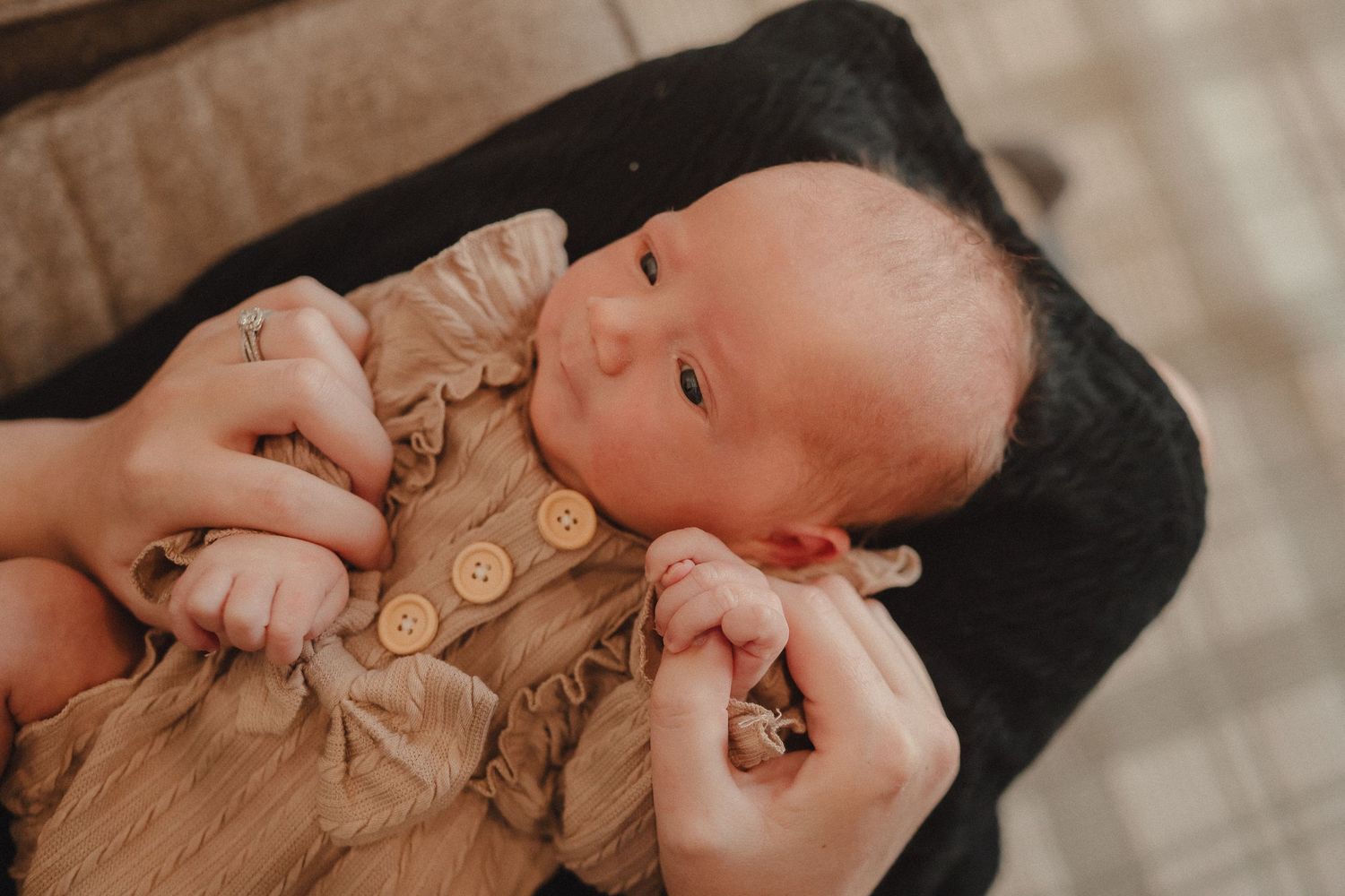 Close-up shots showing gentle moments of connection and tenderness in soft, warm lighting.