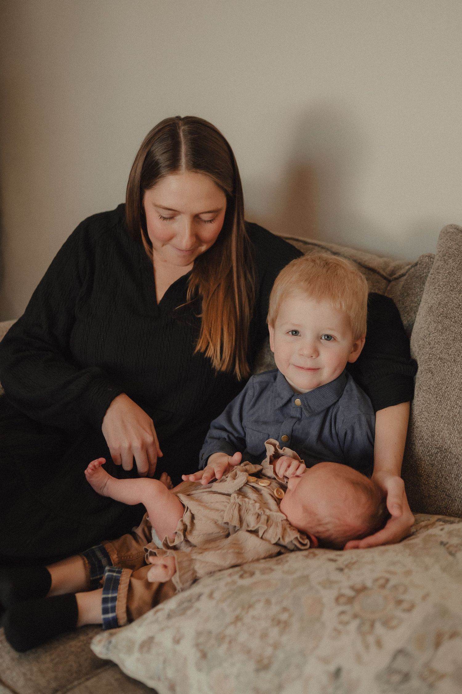 Gentle lifestyle photography sequence showing nurturing moments between family members on a sofa.