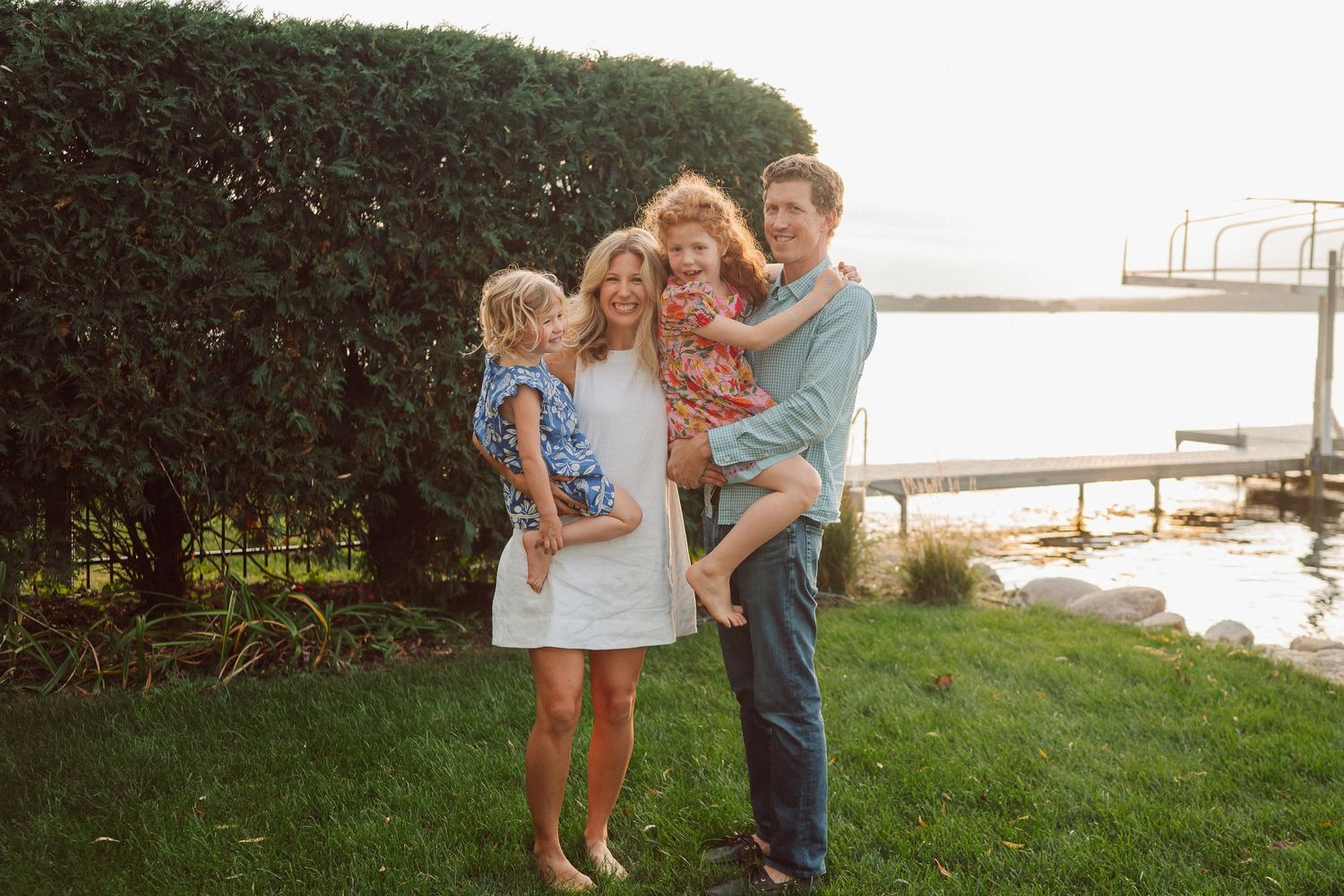 A group enjoys a summer evening by the water's edge in a series of connected candid moments at sunset.