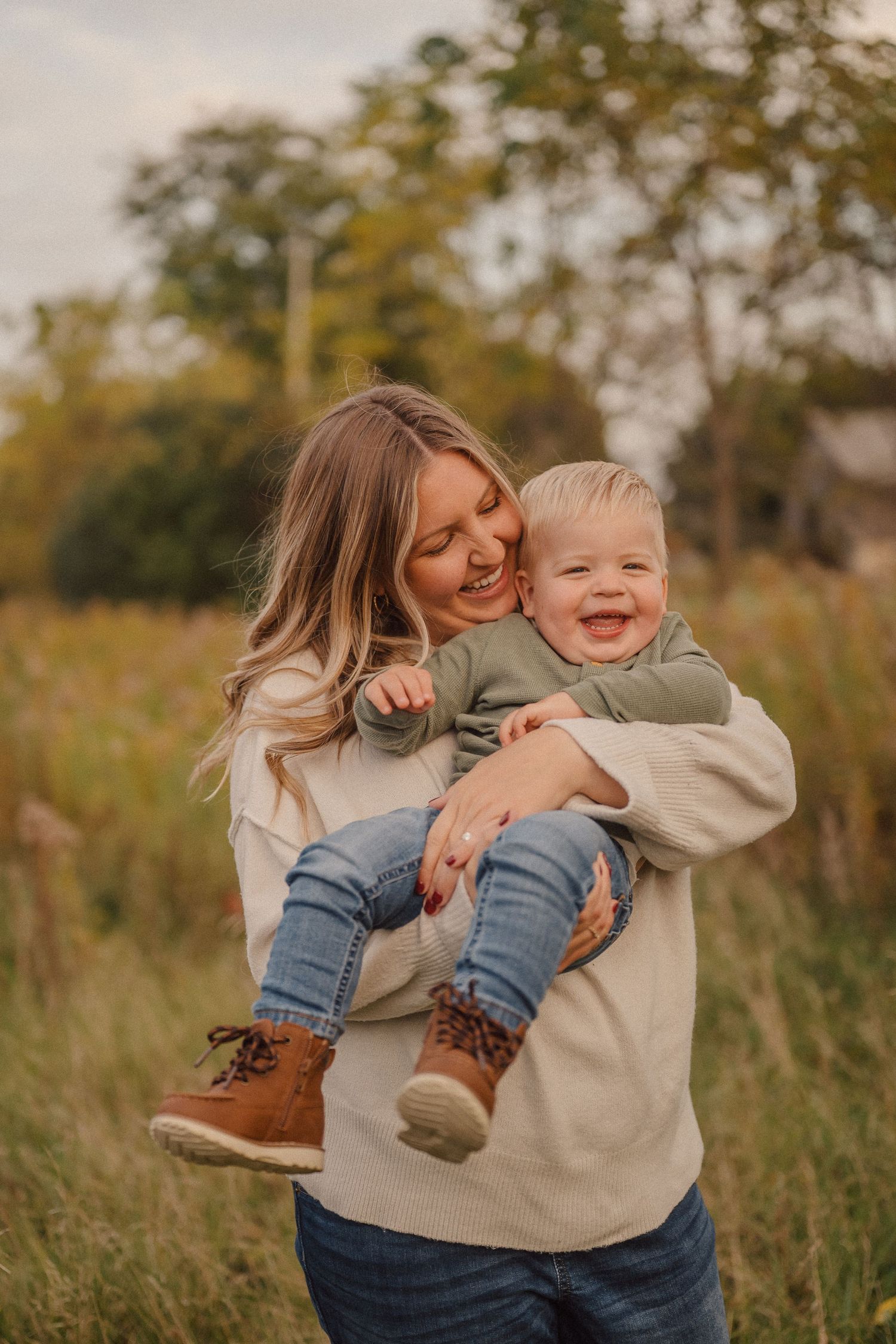 Candid moments of laughter and connection captured in a rustic outdoor setting with warm autumn colors.