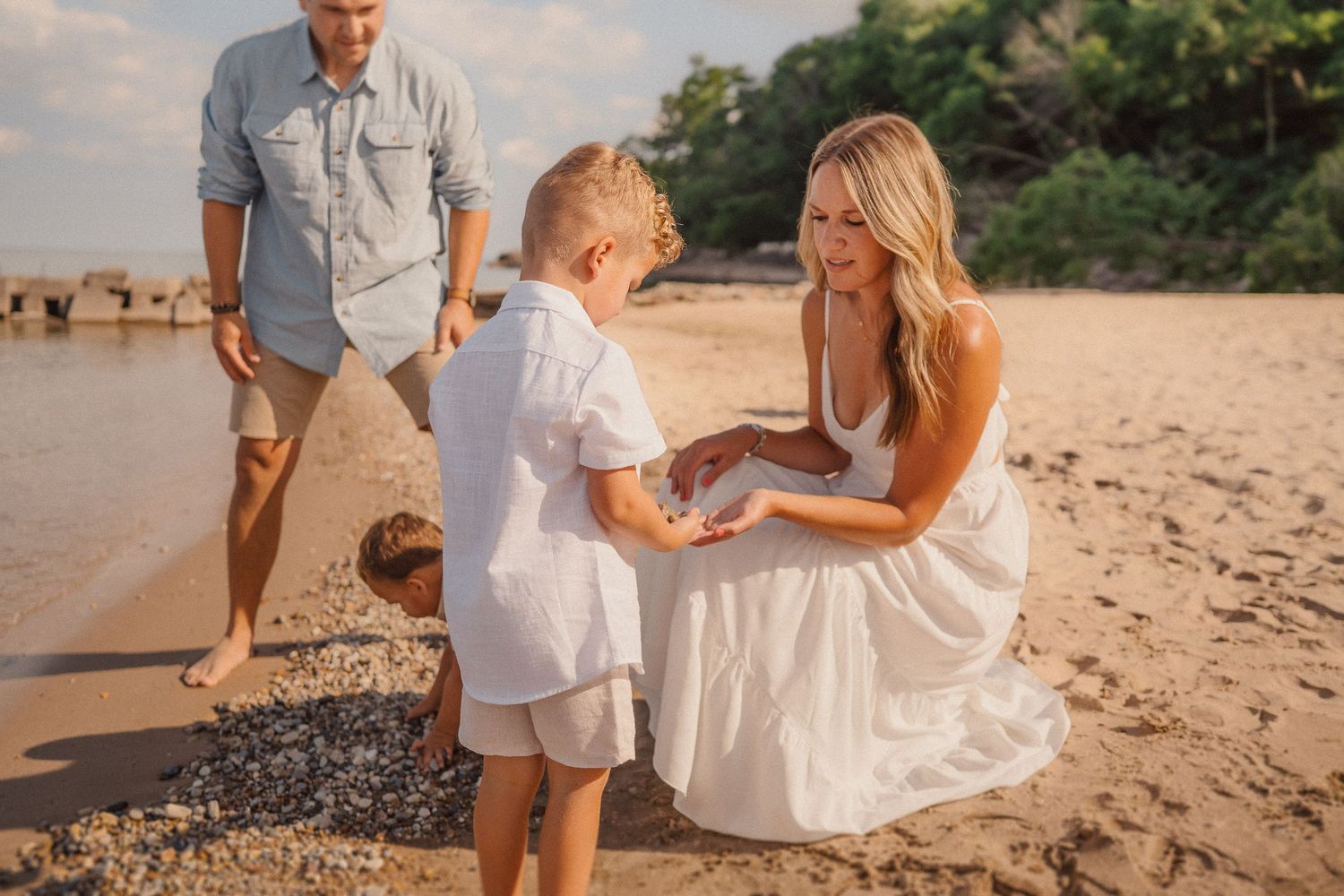 Sweet interaction on a tropical beach with gentle waves in the background.