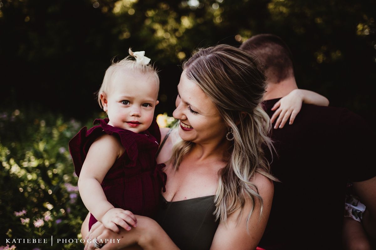 Intimate outdoor portrait of loving family members embracing.