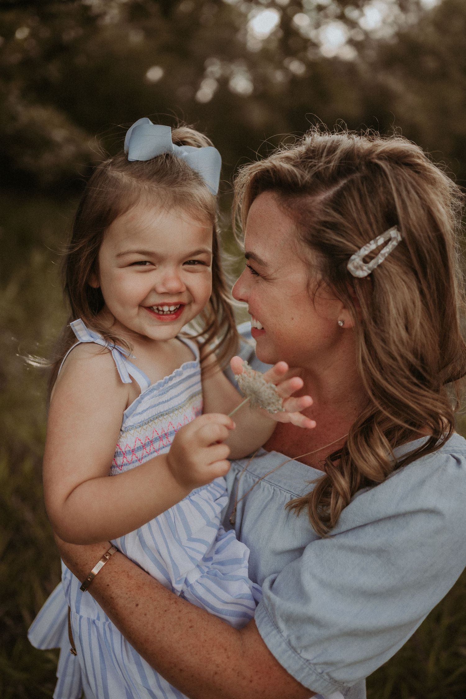 A joyful moment of laughter and connection captured during golden hour.