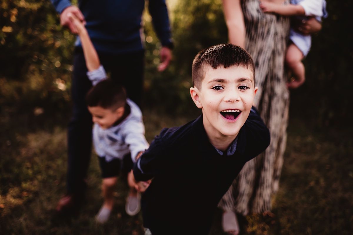 Energetic outdoor photograph capturing playful moment in natural setting.