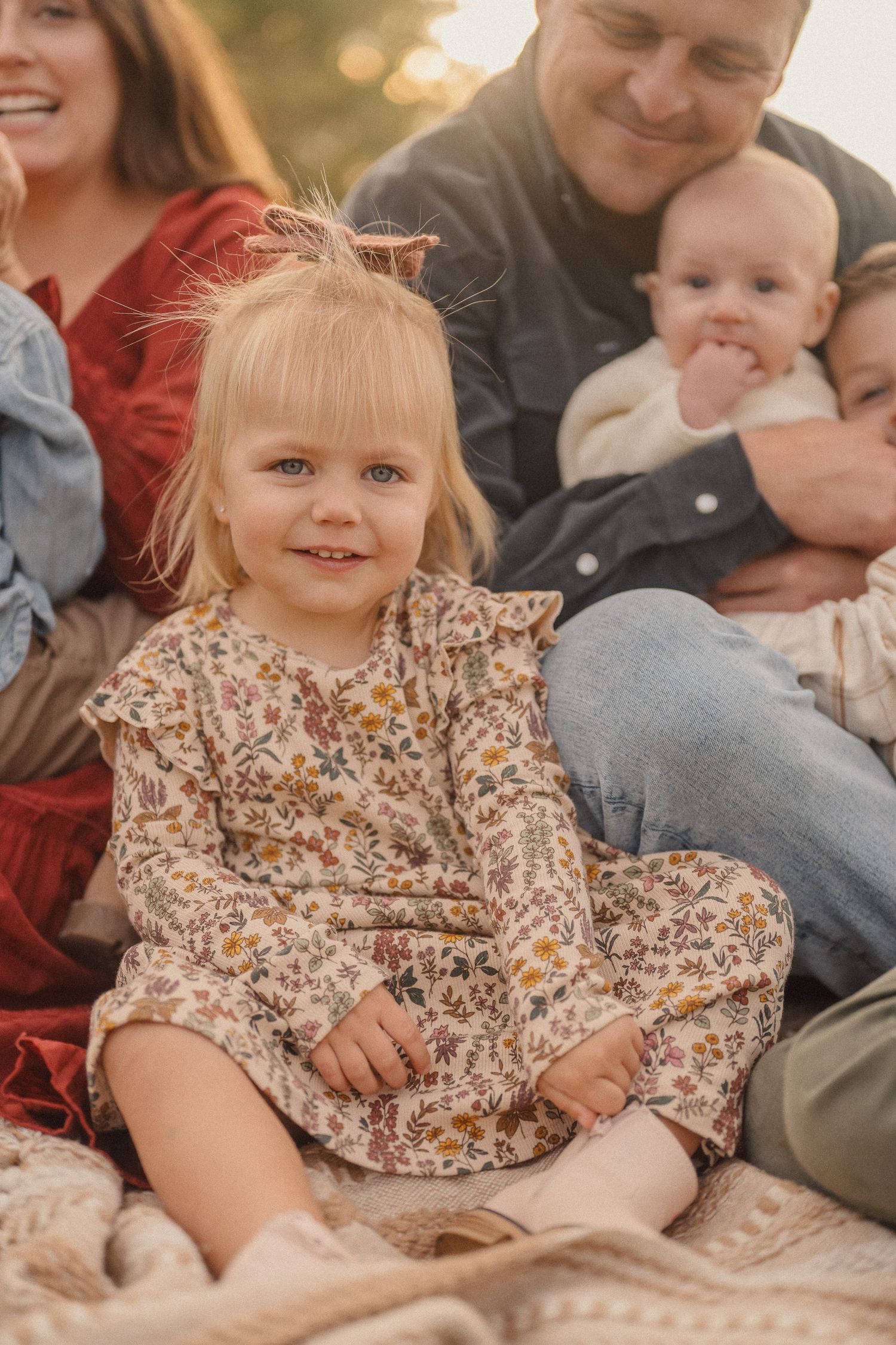Intimate family portrait session with soft golden lighting and natural poses.
