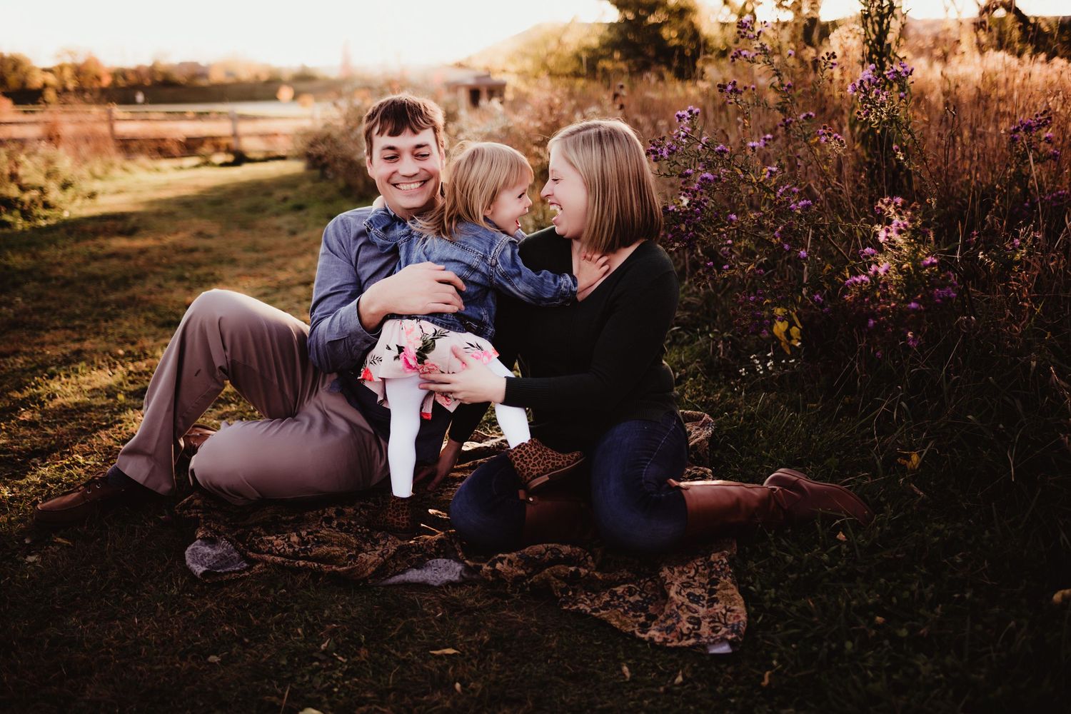 Family enjoying quality time together outdoors during golden hour.