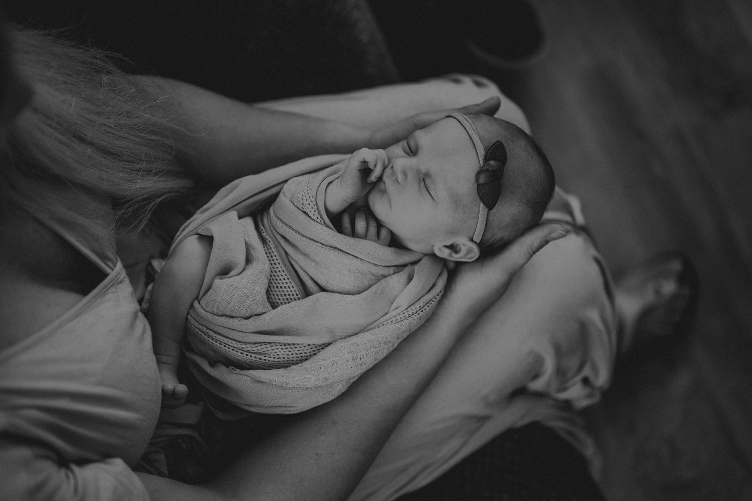 Artistic black and white portrait of joy and laughter during an intimate family moment.