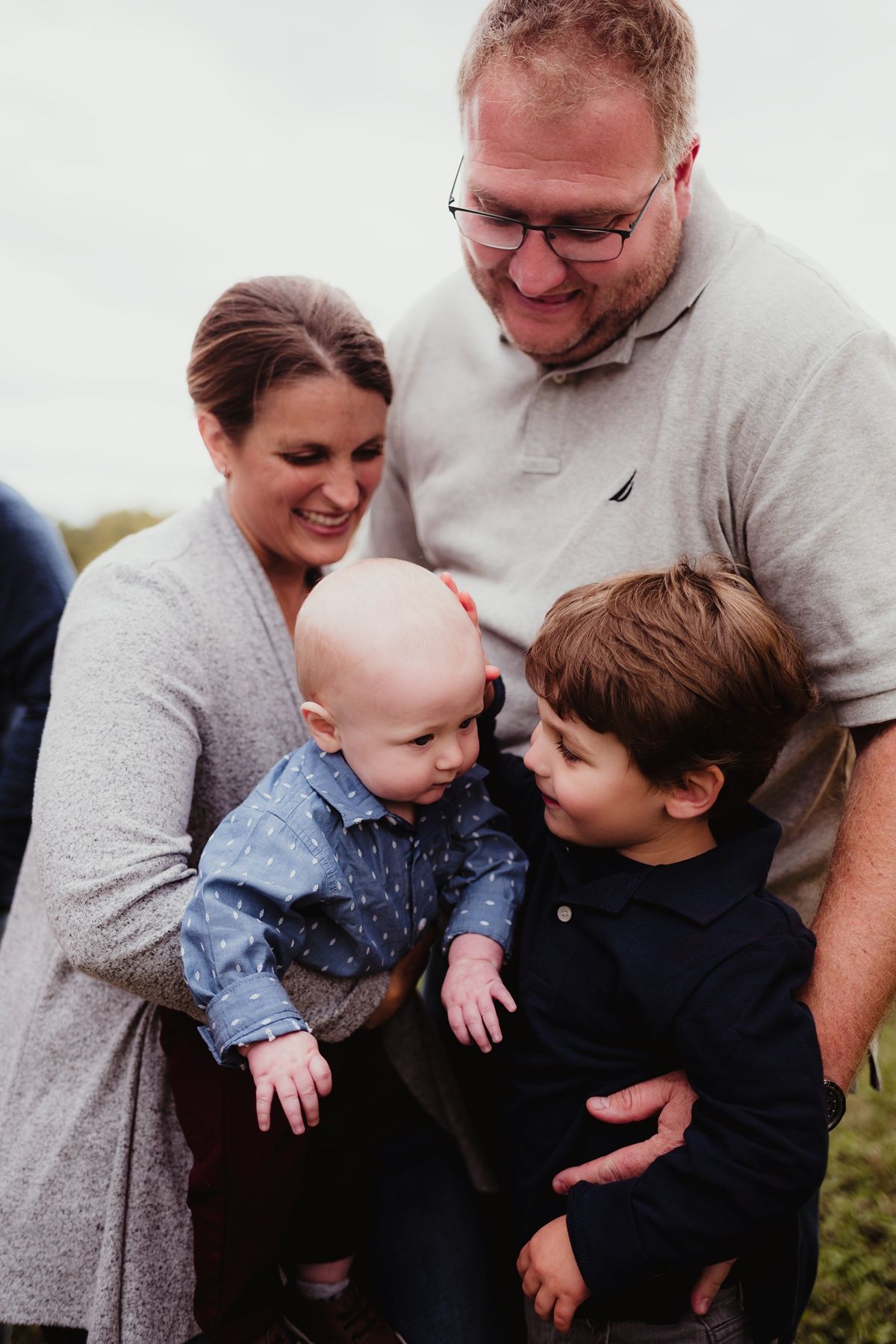 Intimate family moment shared between parents and children.