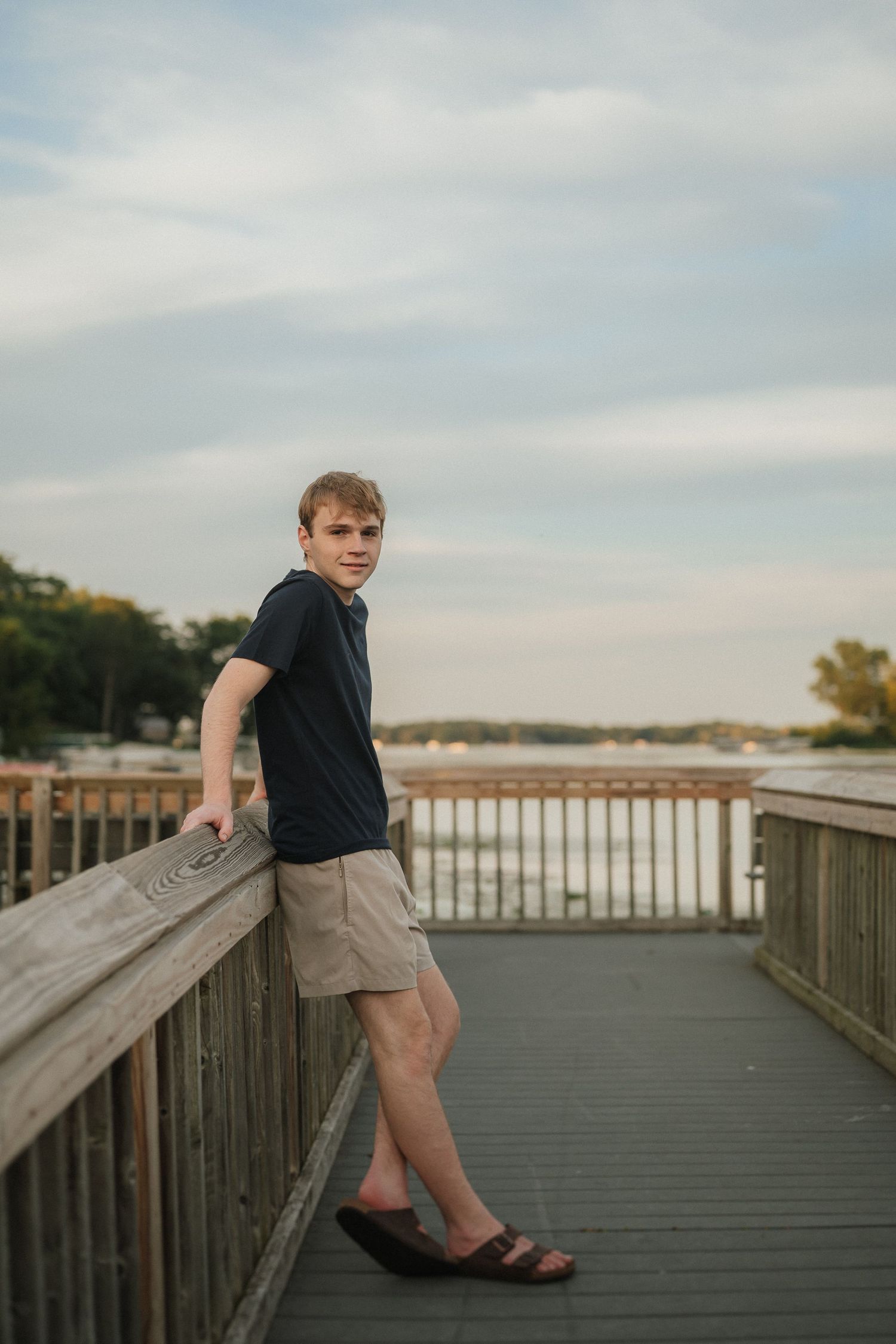 Multiple angles of a boardwalk overlooking a waterfront with cloudy skies in the background.