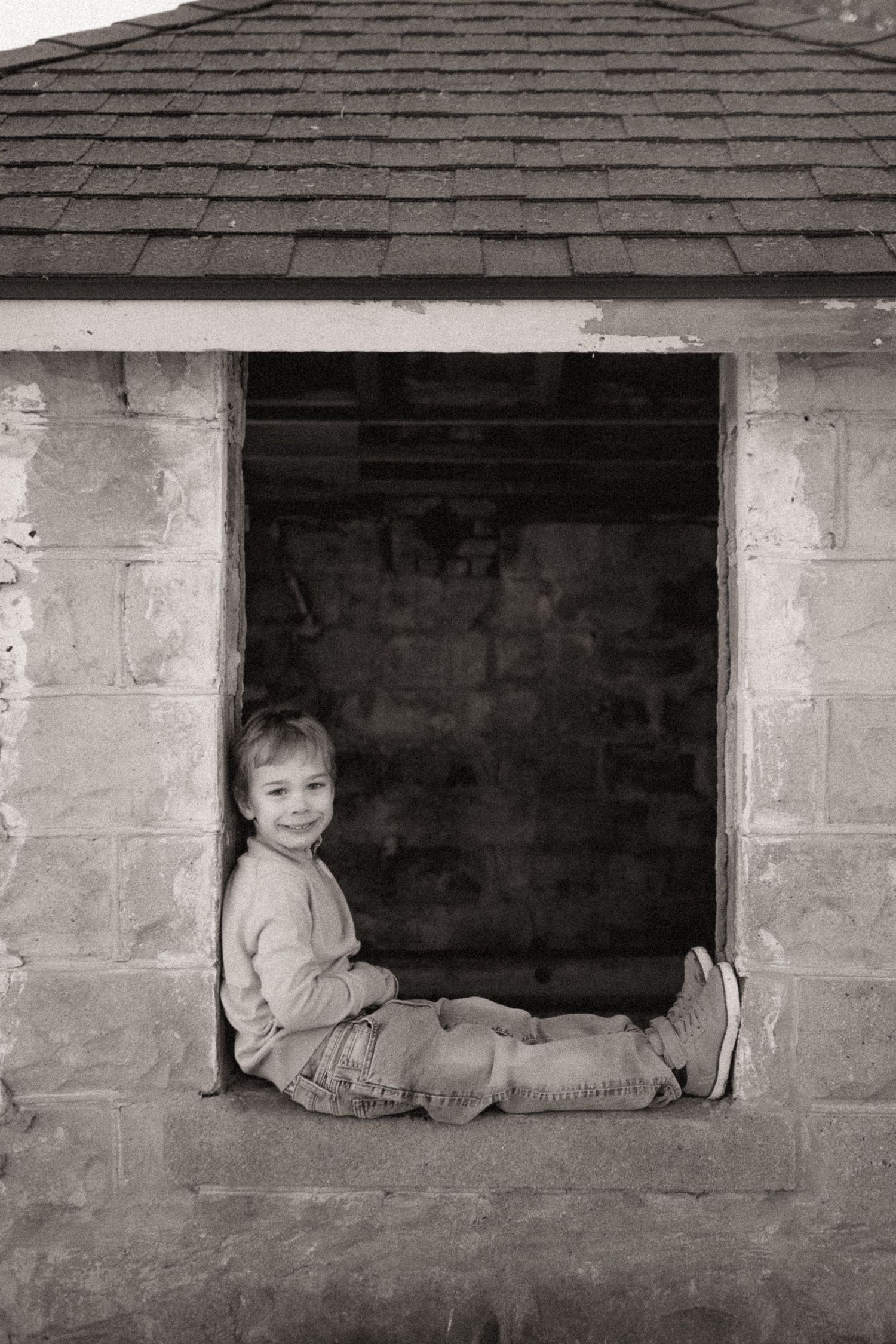 A creative series of black and white photos taken through a basement window opening.