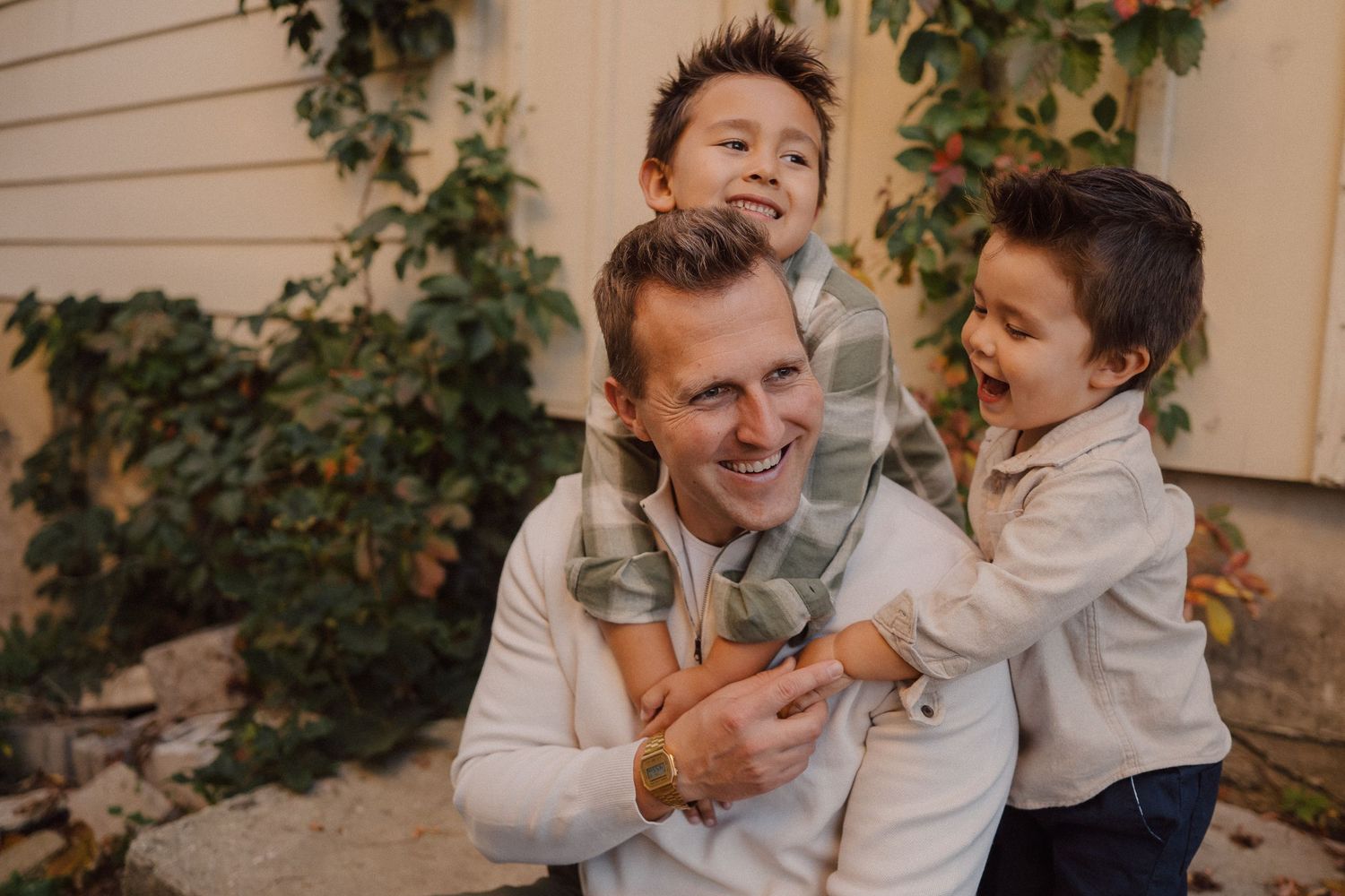 Two children sharing a playful moment together in casual attire.