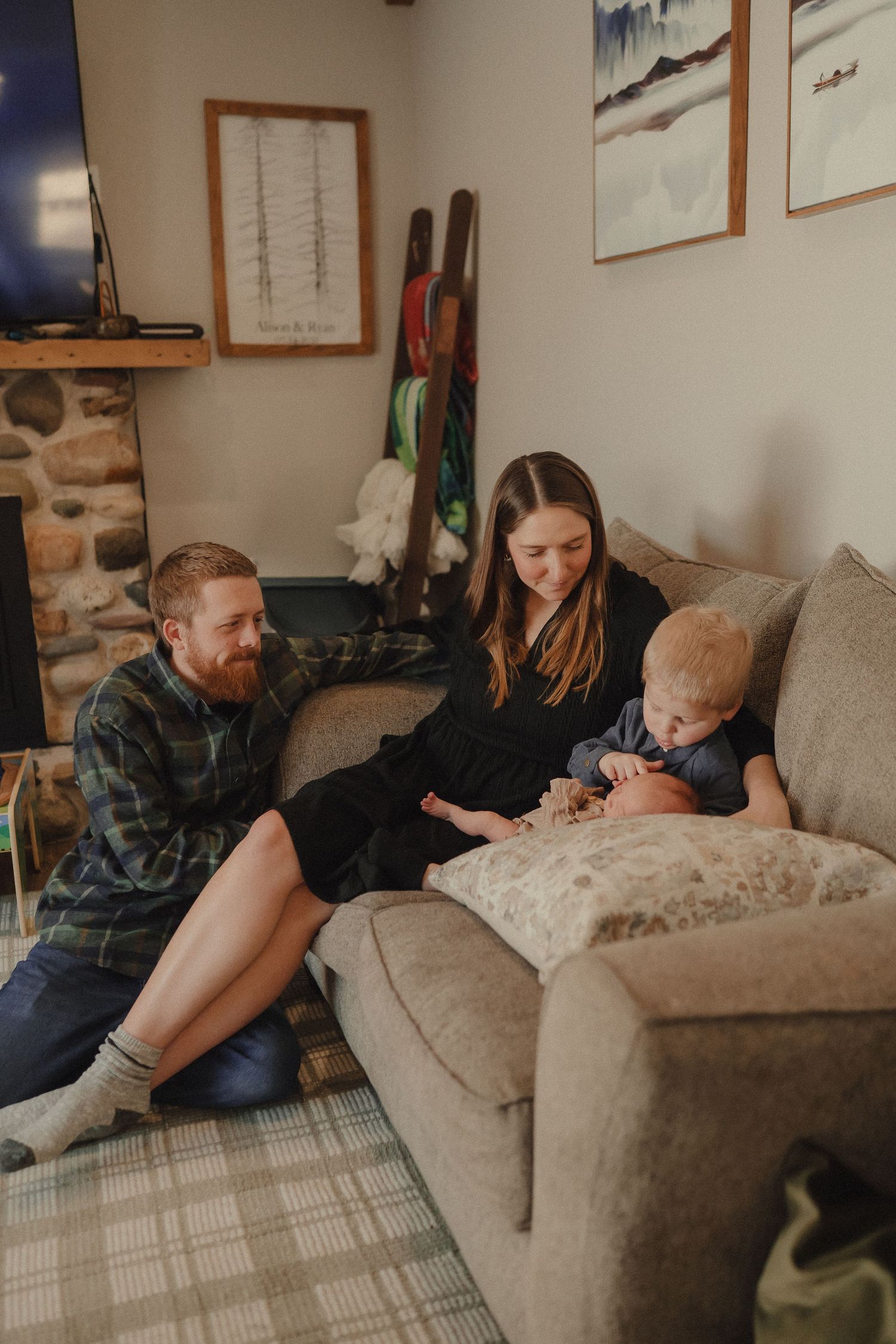 A series of photos showing tender moments shared between family members on a cozy gray couch at home.