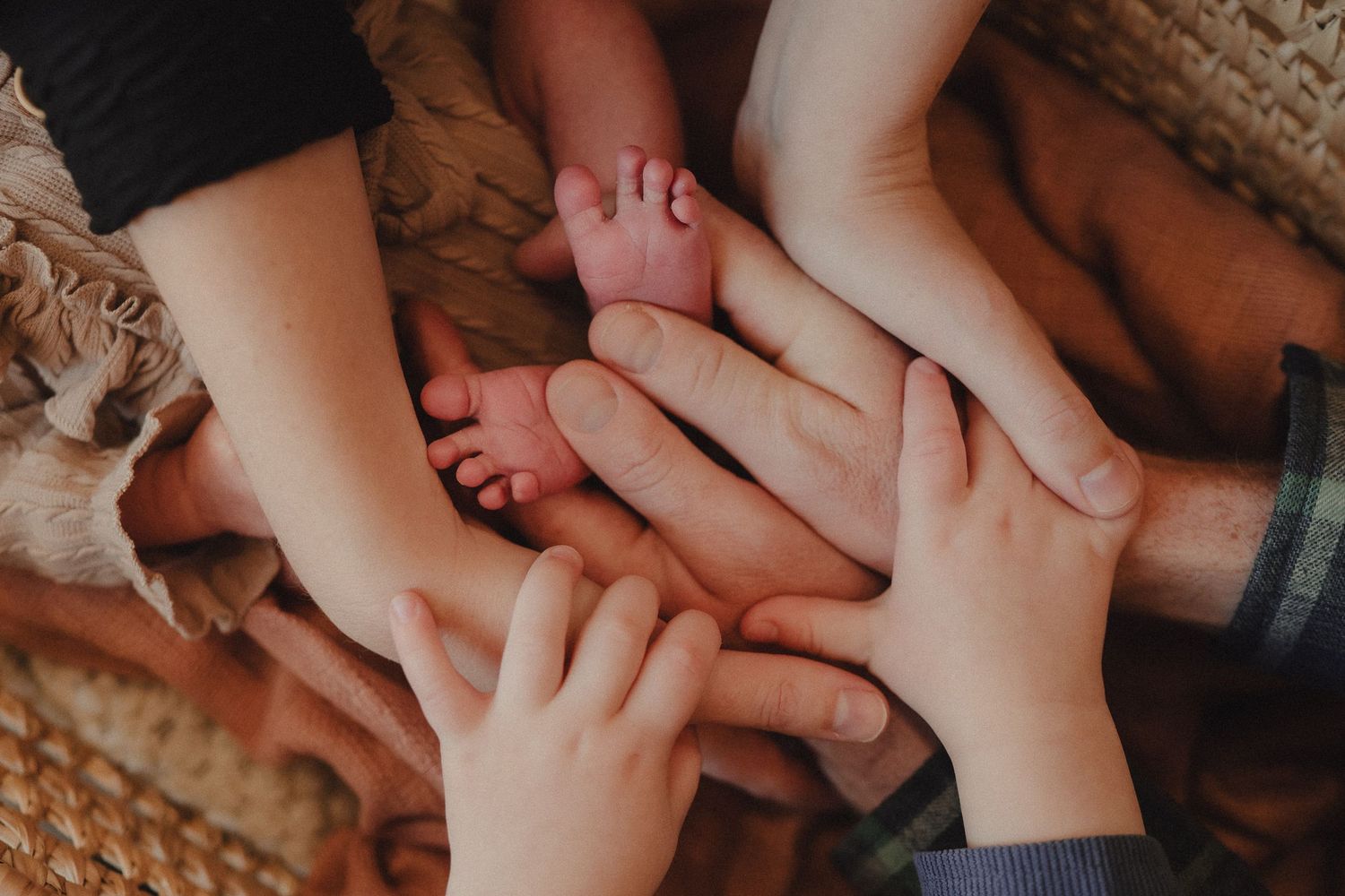 Close-up shots of gentle hands touching and holding in an intimate sequence.