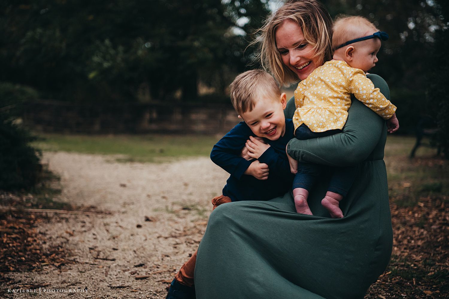 A playful moment outdoors with children on a fall day.