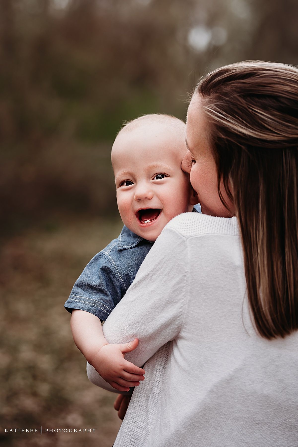 Heartwarming family moment captured during outdoor photoshoot.