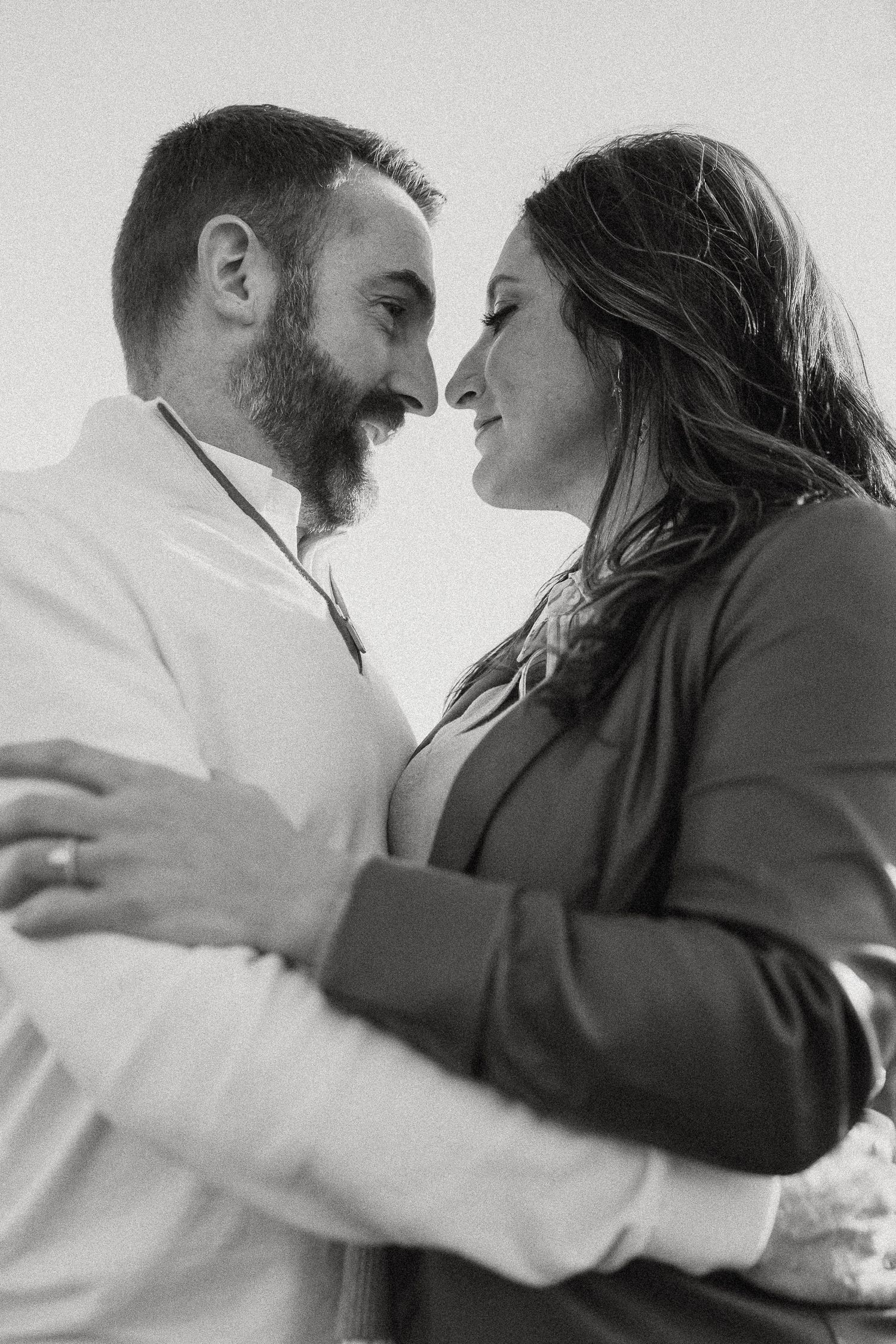 Intimate black and white romantic portrait sequence showing tender moments between a couple.