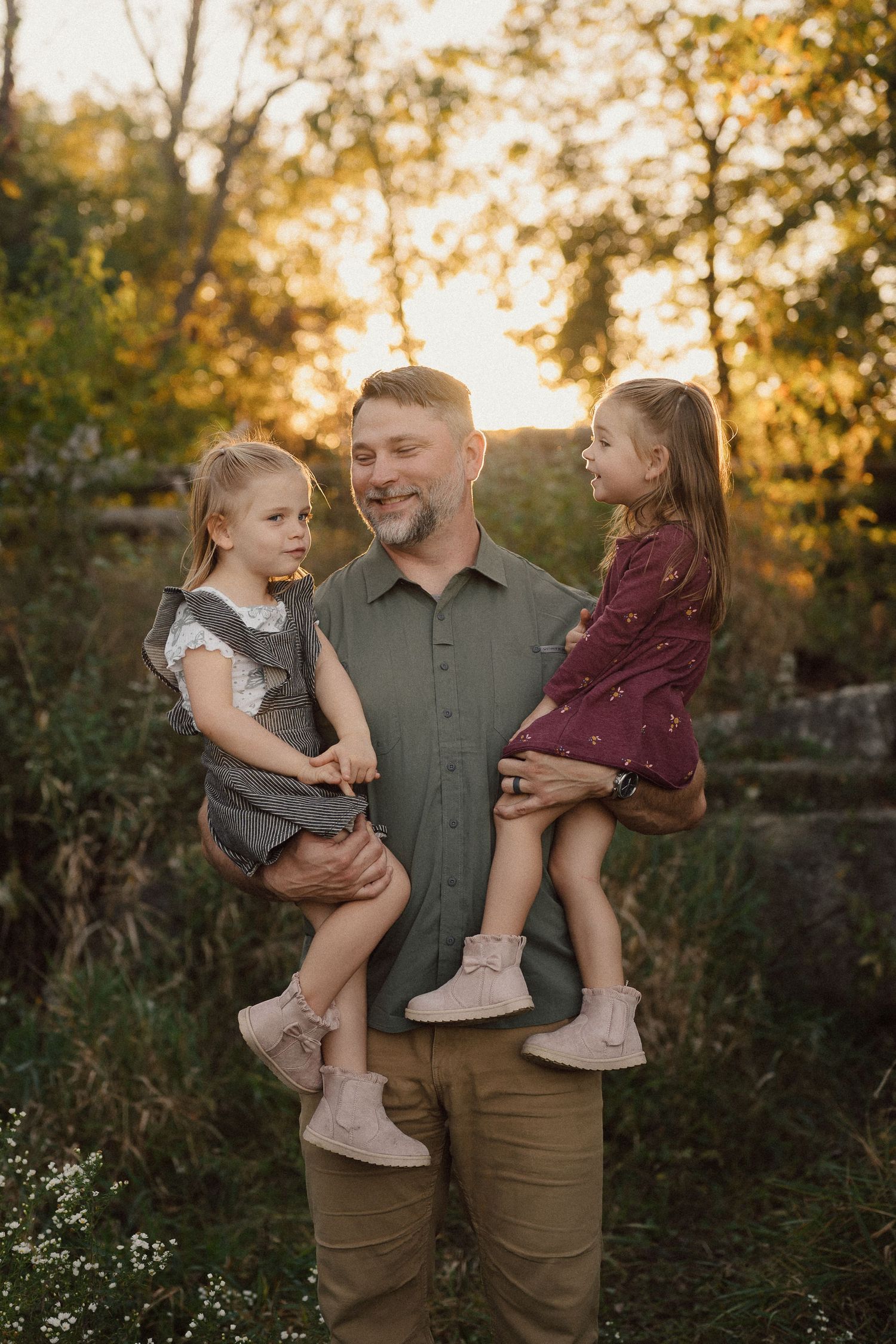Candid family moments captured in a natural outdoor setting during golden hour.