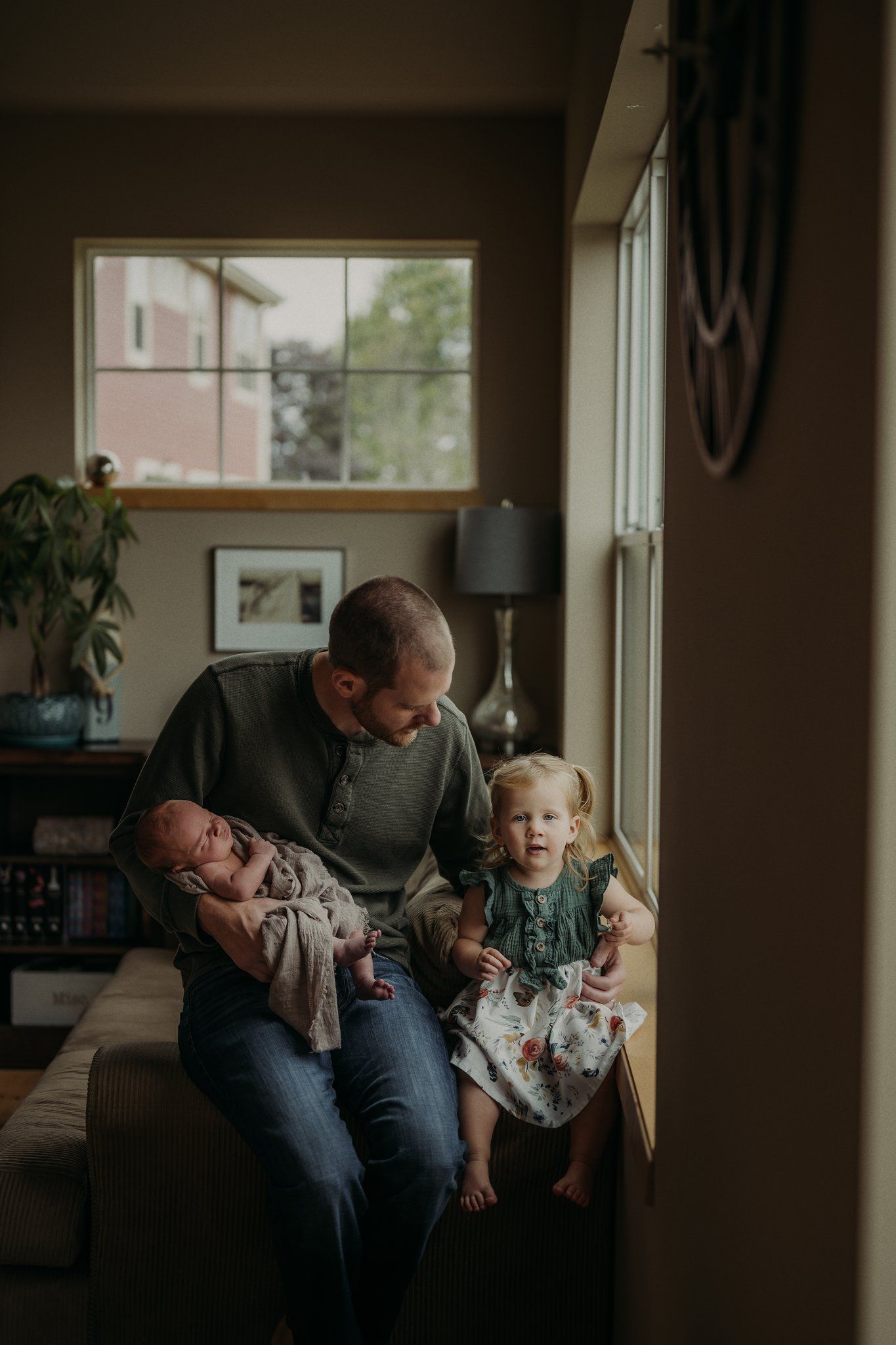 A cozy indoor family moment by the window with natural light streaming in.