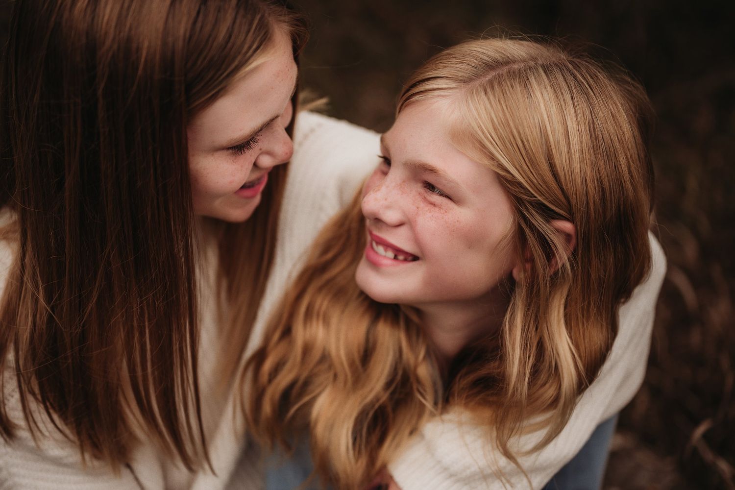 Intimate portrait capturing genuine laughter and connection between two people.