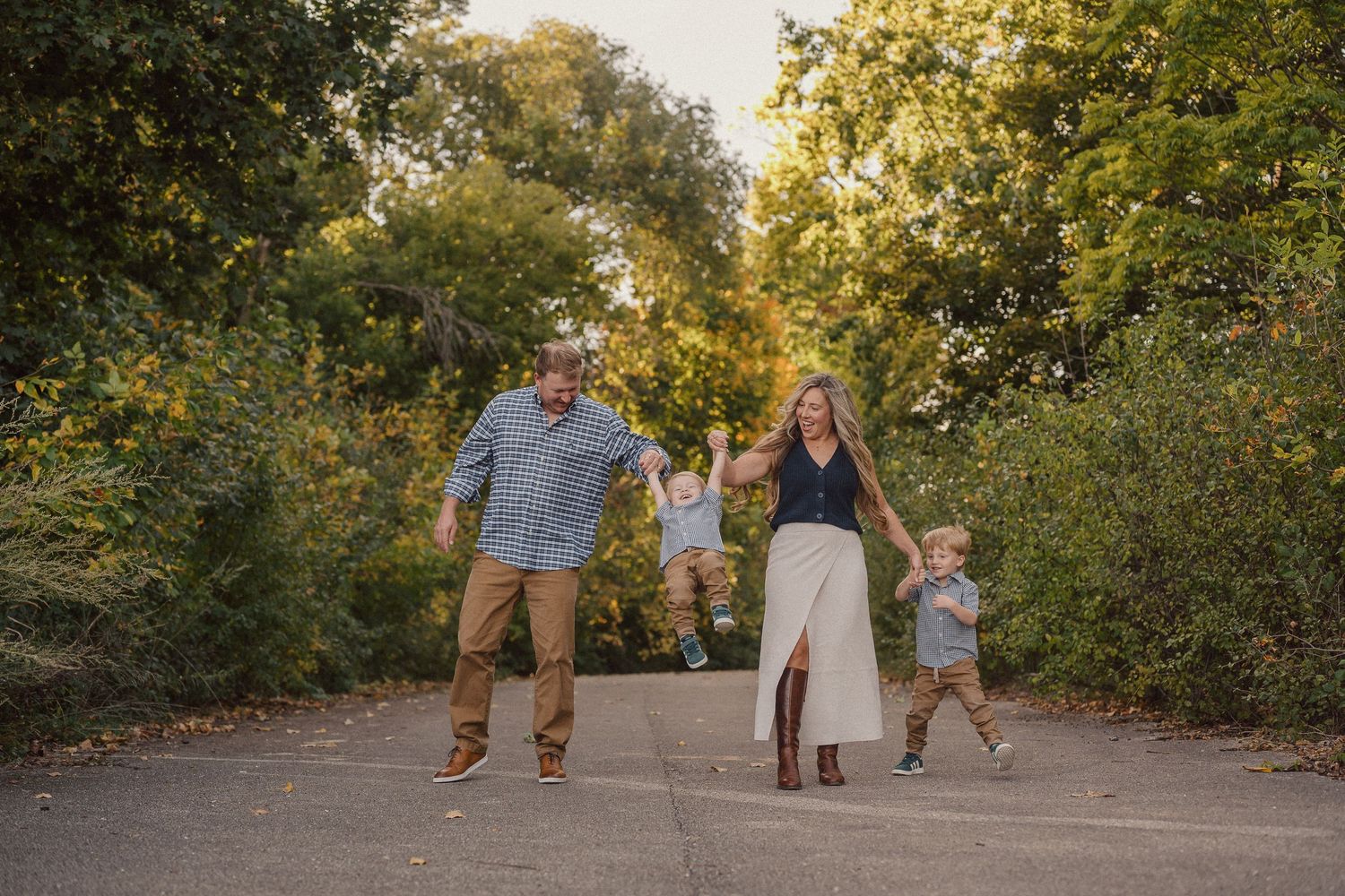 A sequence of walking feet on a nature path during golden hour creates a playful progression through the frame.