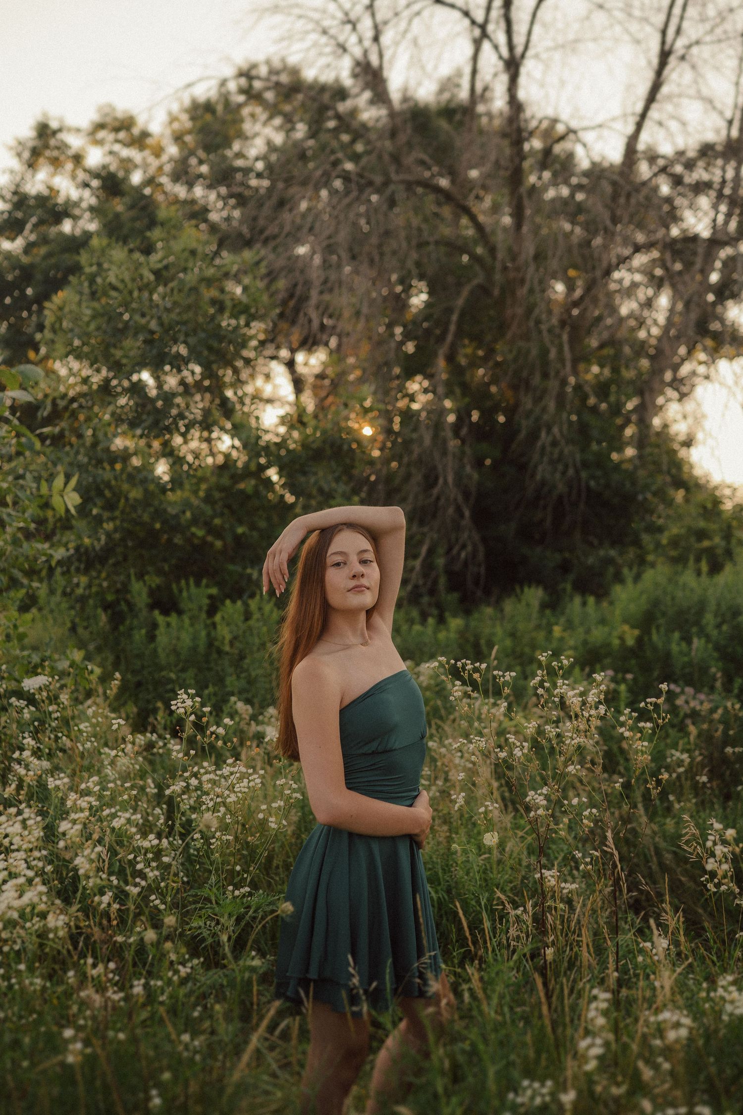 A series of romantic summer photographs showing poses among white wildflowers at golden hour.