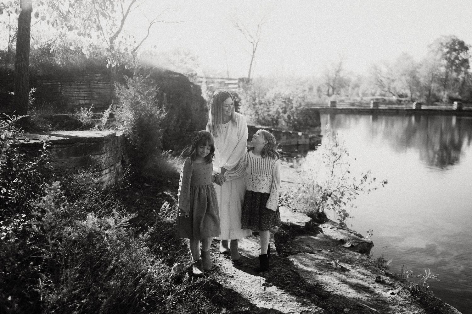 A collection of vintage black and white photographs showing rural riverside scenes with boats and buildings.