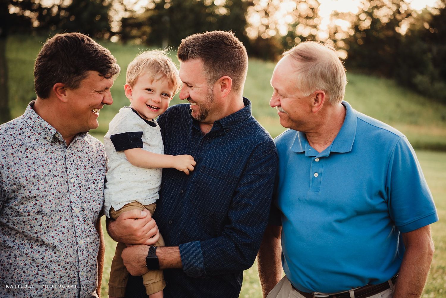Multi-generational family gathering outdoors at sunset sharing warm moments together.