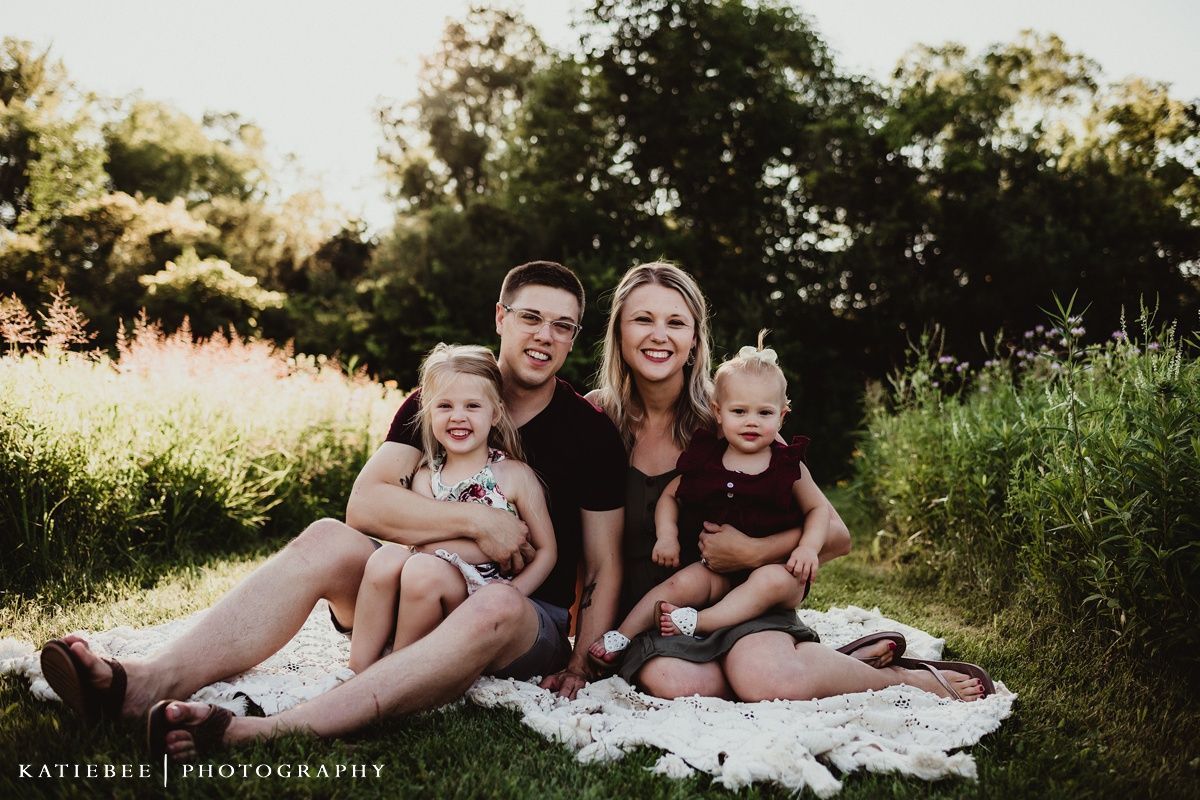 Joyful summer family moment captured in golden evening light.