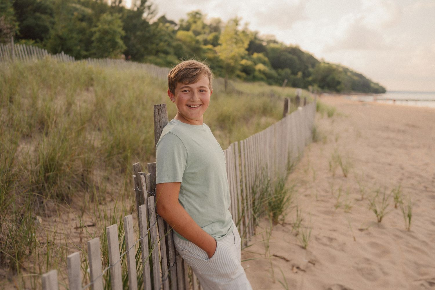 A sequence of beach photographs showing sandy dunes, wooden fences, and coastal vegetation at sunset.