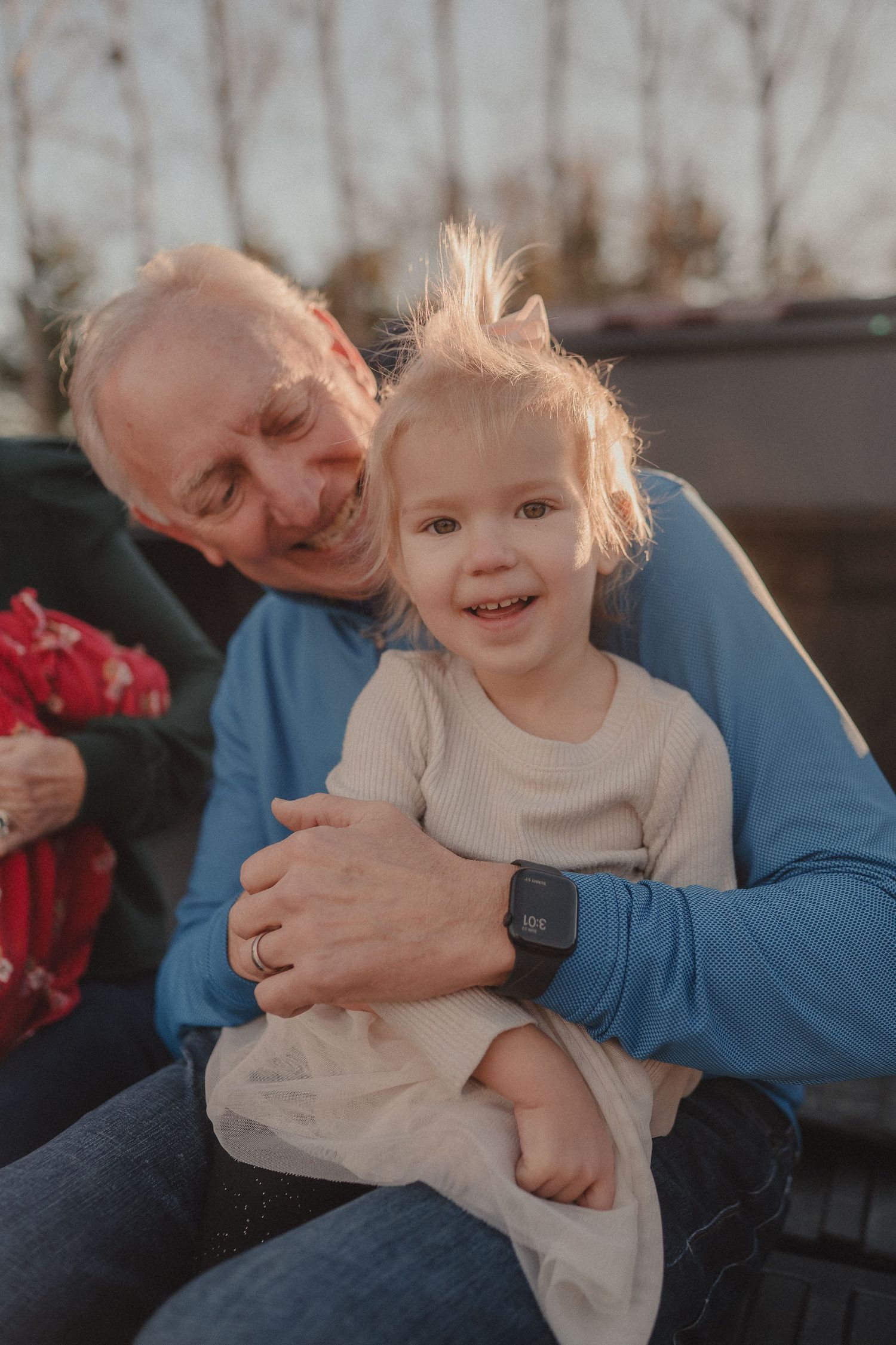Candid moments of joy and laughter shared while sitting in truck bed.