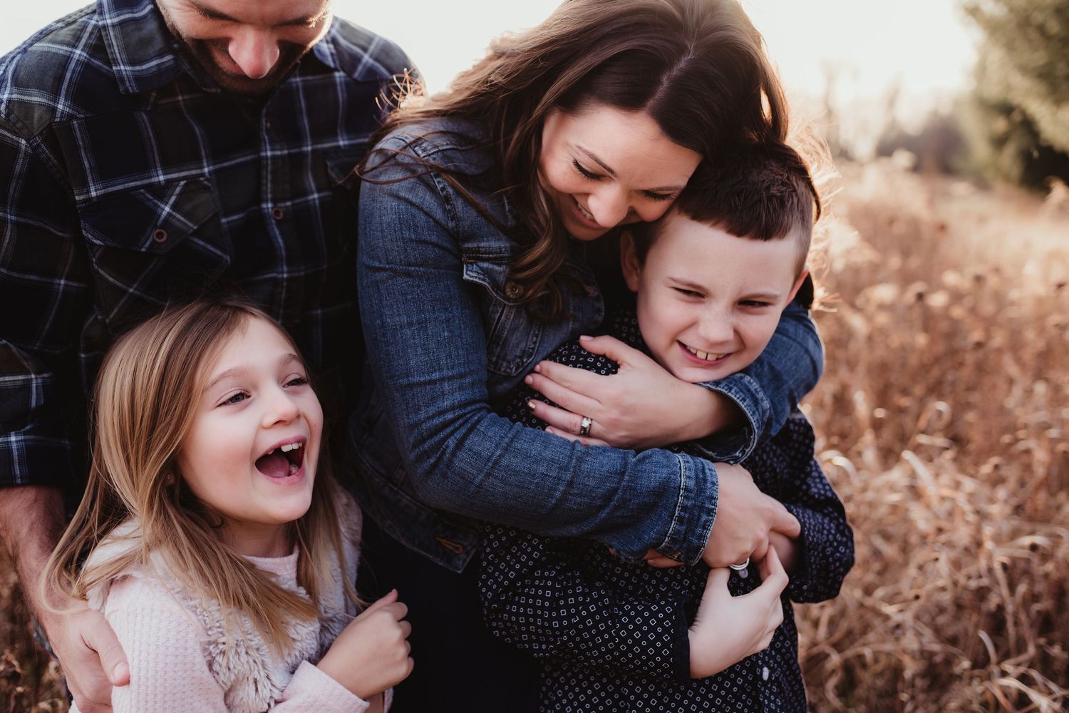 A joyful family moment captured in a candid embrace with laughter and genuine emotions.