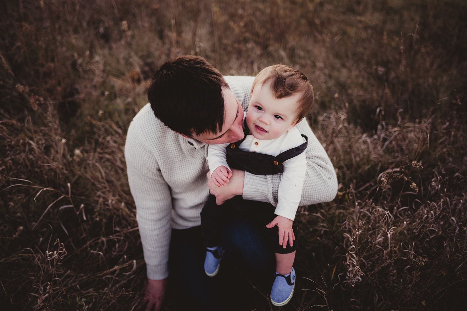 A tender moment shared during an outdoor autumn photo session.