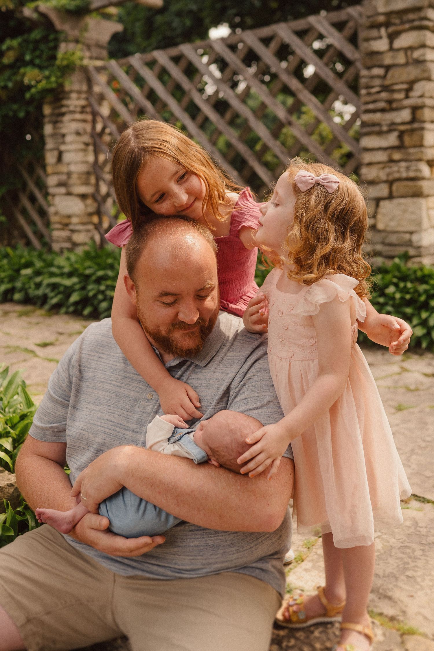 Heartwarming family moments shared between loved ones against a stone wall backdrop.
