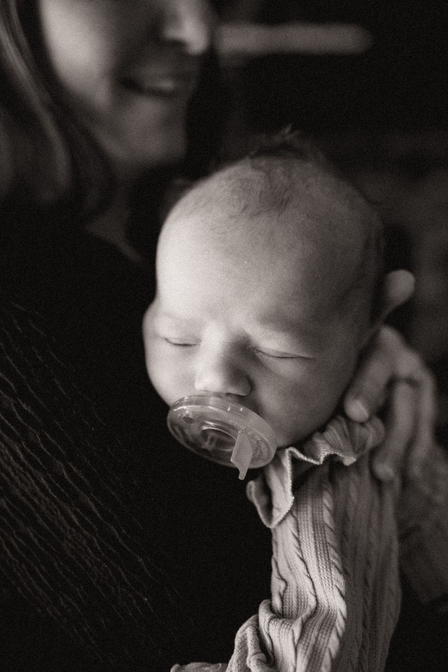 Artistic black and white close-up photos showing gentle interaction with soft fabric.