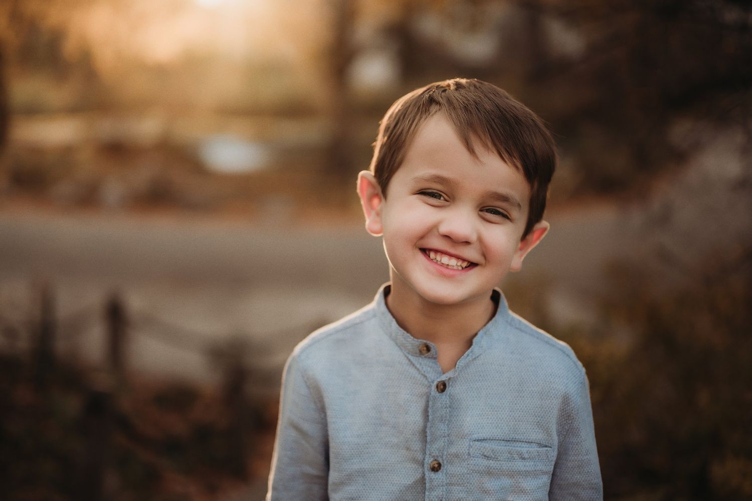 Warm sunset portrait showing joy and natural expressions outdoors.