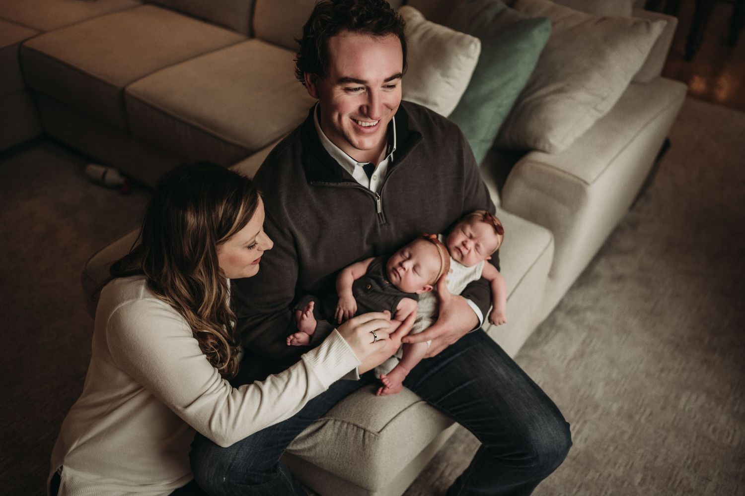 Lifestyle photo on a gray couch in warm, natural lighting.