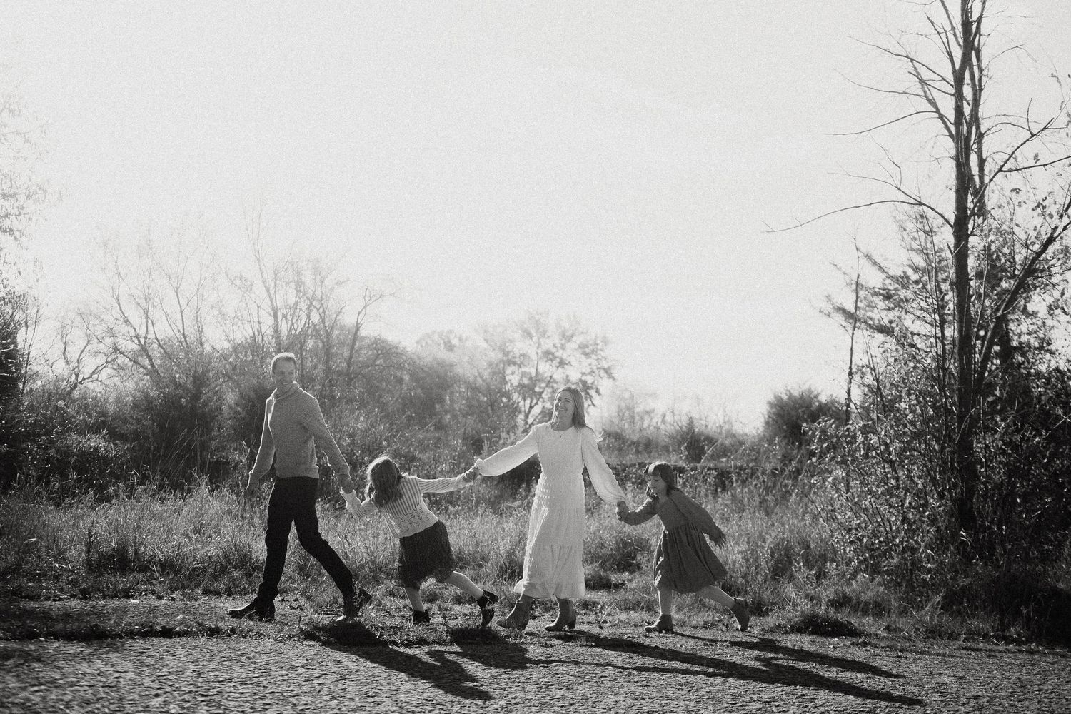 Black and white landscape photograph showing silhouettes against a natural outdoor backdrop.