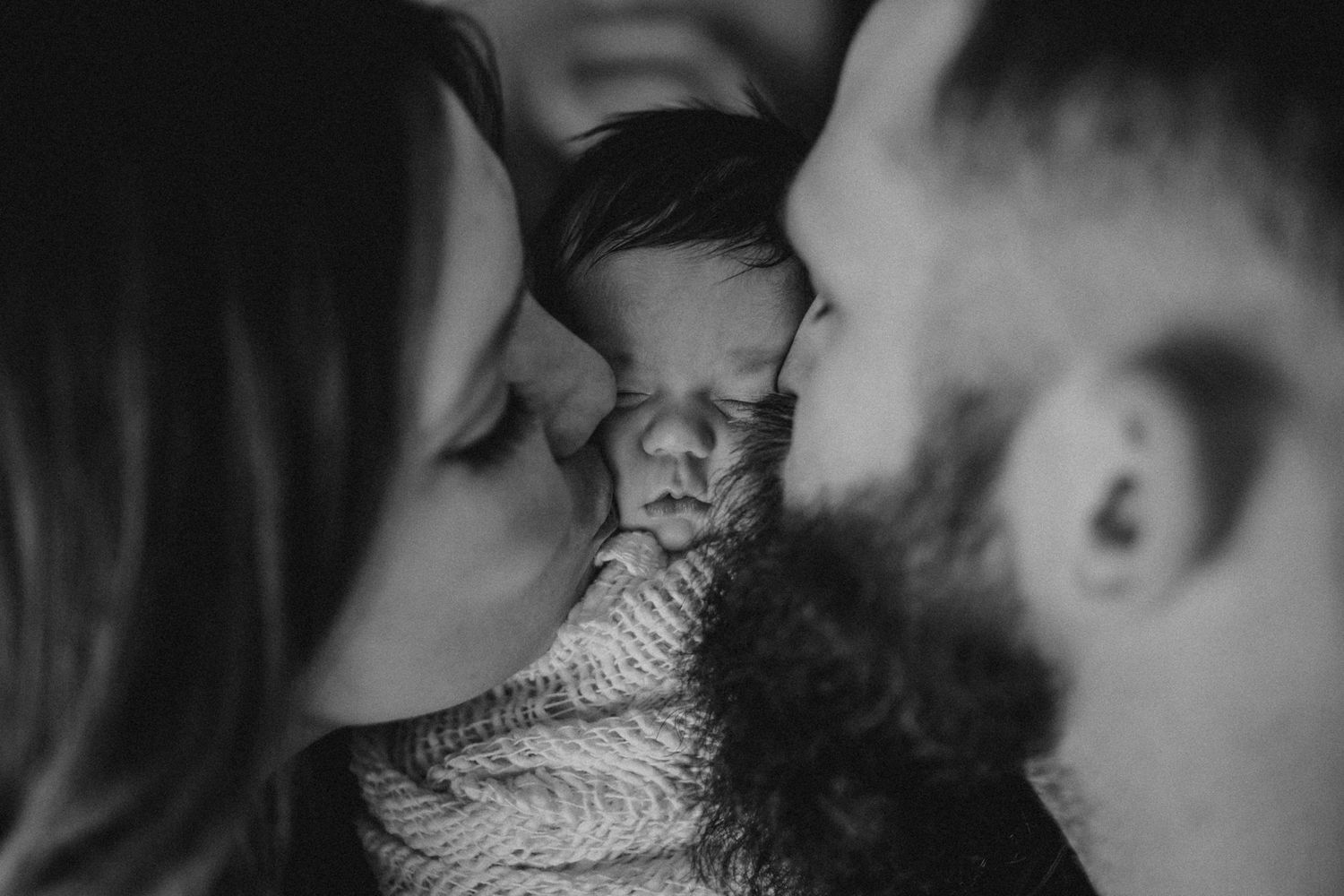 Black and white intimate portrait with soft knit blanket wrap.