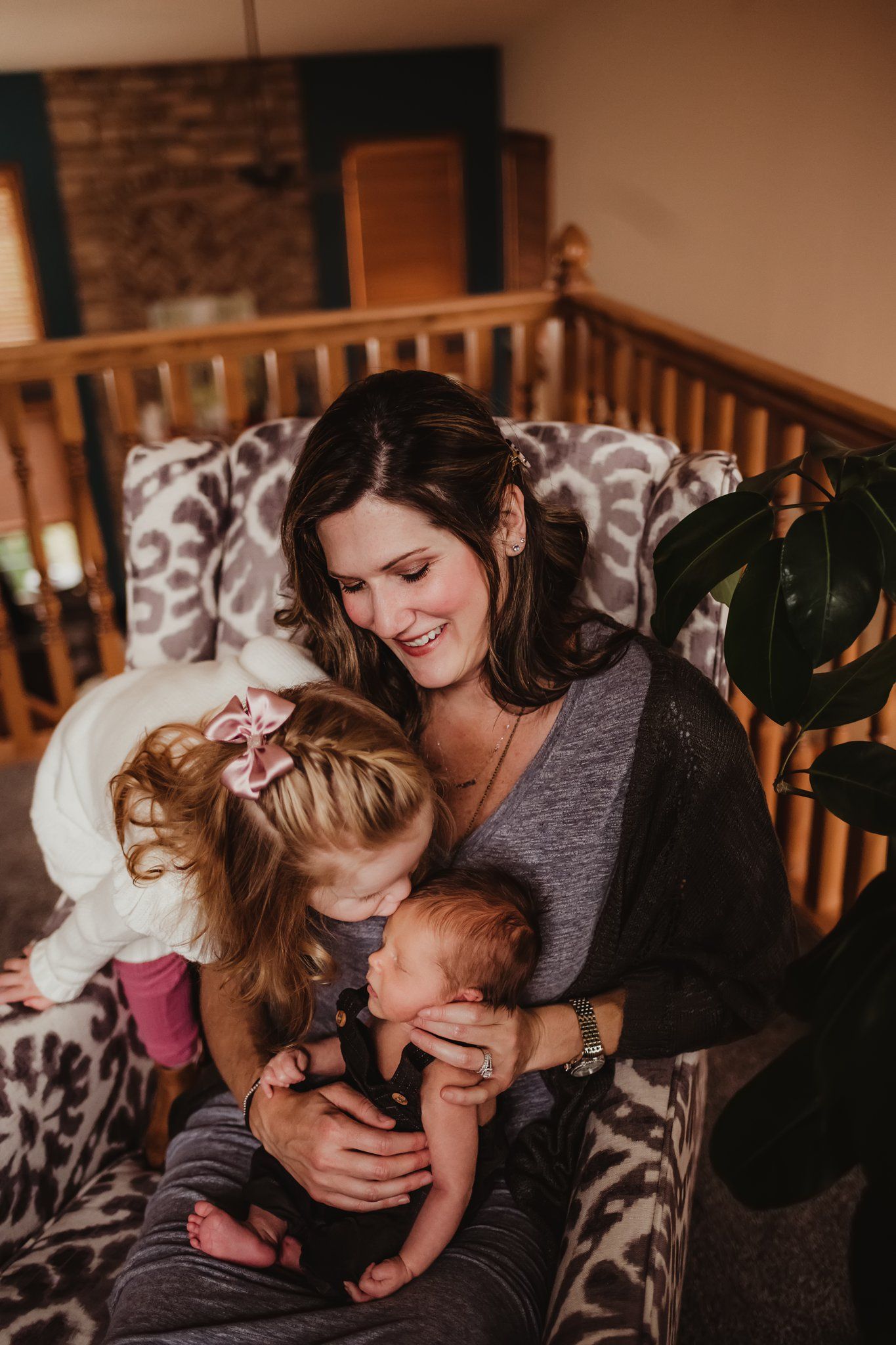 A candid family moment shows warmth and connection while seated on a decorative chair.